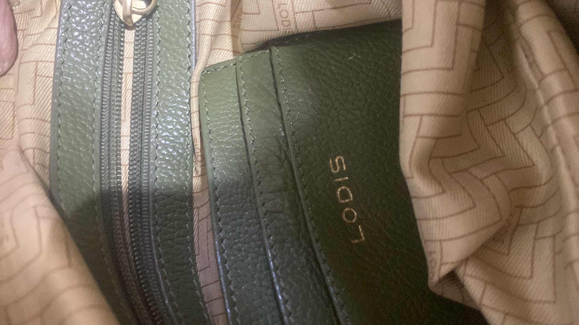 Photo 1 of $100 LODIS MADISON FRONT POCKET HANDBAG - GREEN