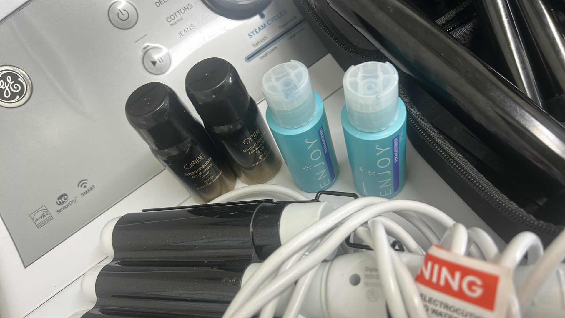 Photo 4 of CURLING IRONS AND HAIR PRODUCTS