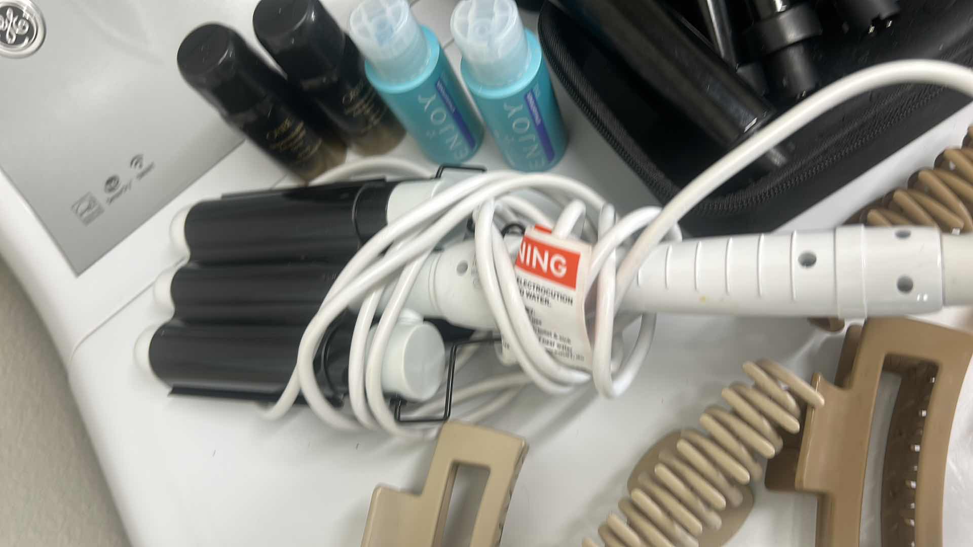 Photo 3 of CURLING IRONS AND HAIR PRODUCTS