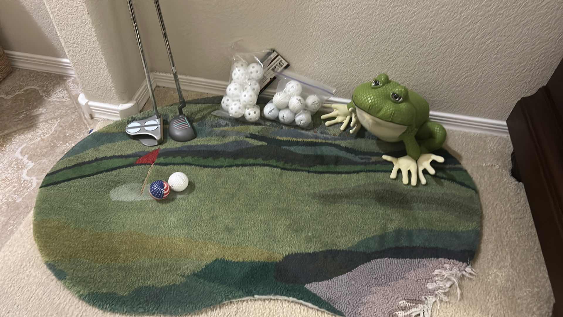 Photo 2 of 2 GOLF PUTTERS, GOLF AND WIFFLE BALLS, RUG AND FROG