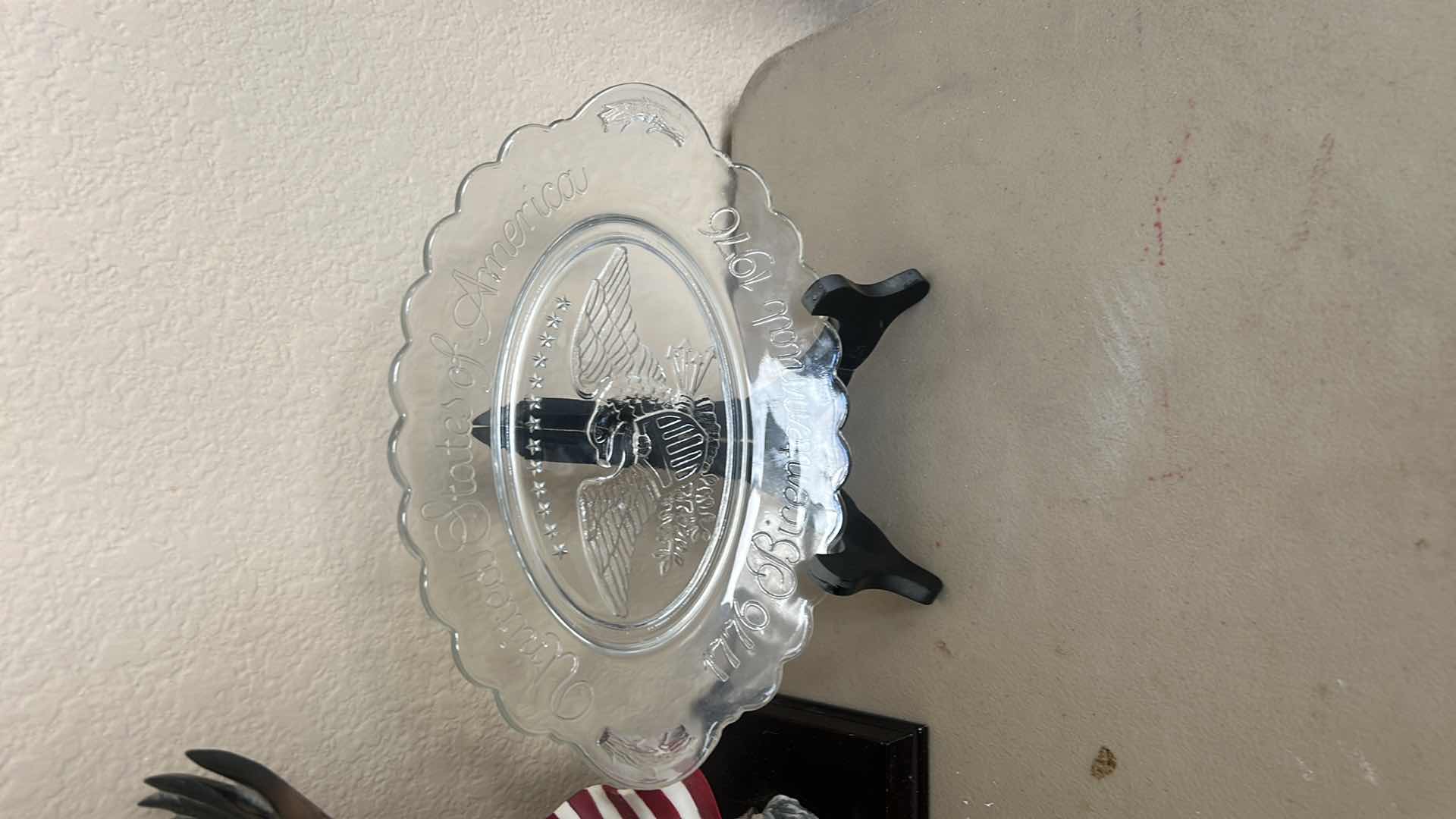 Photo 1 of 2 - AMERICANA PIECES, EAGLE AND FLAG STATUE H9.5” AND BICENTENNIAL PLATE