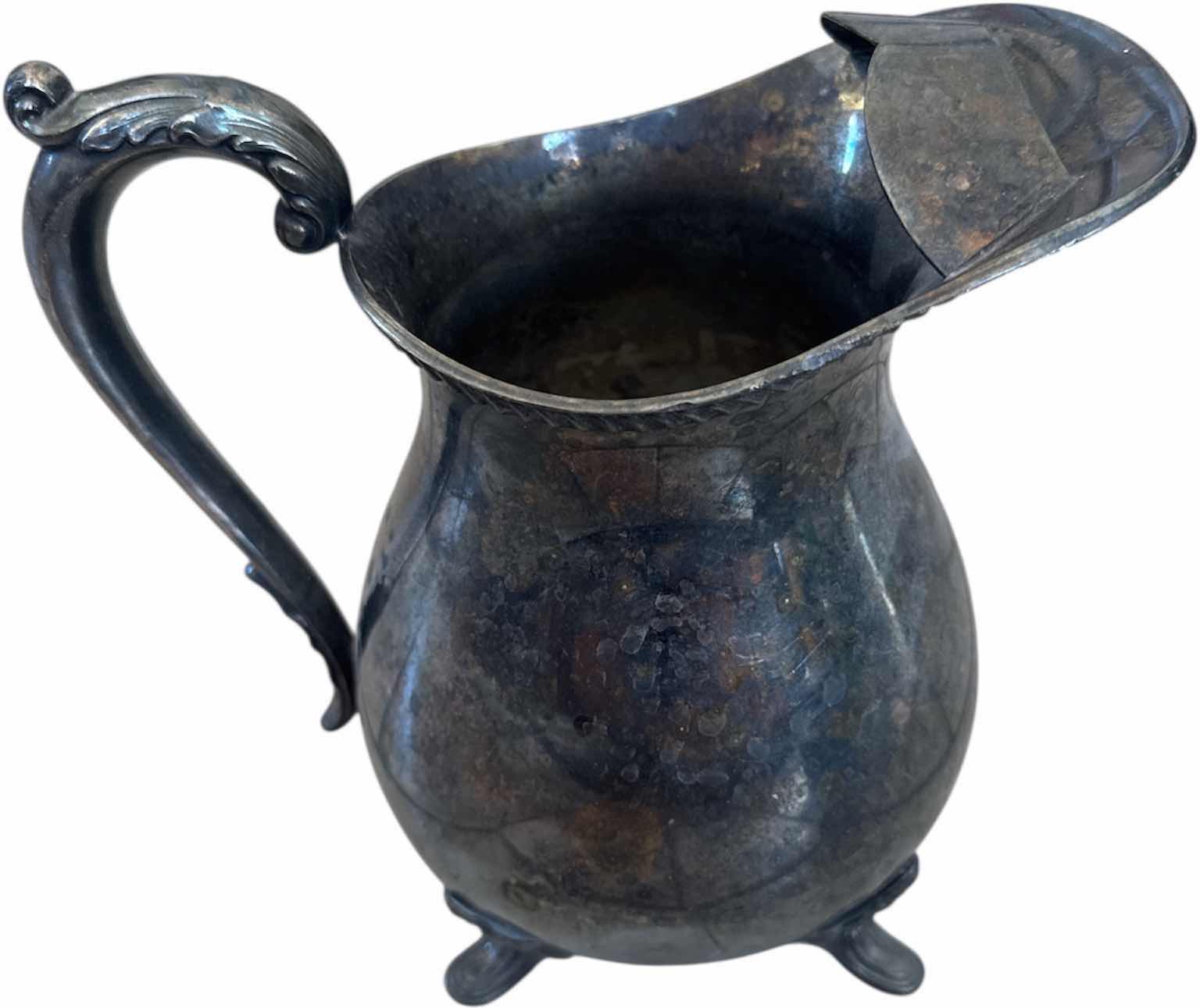 Photo 1 of 2- ANTIQUE SILVER PLATED WATER PITCHER AND SHEFFIELD SUGAR BOWL WITH LID

H8.25” AND SMALLER