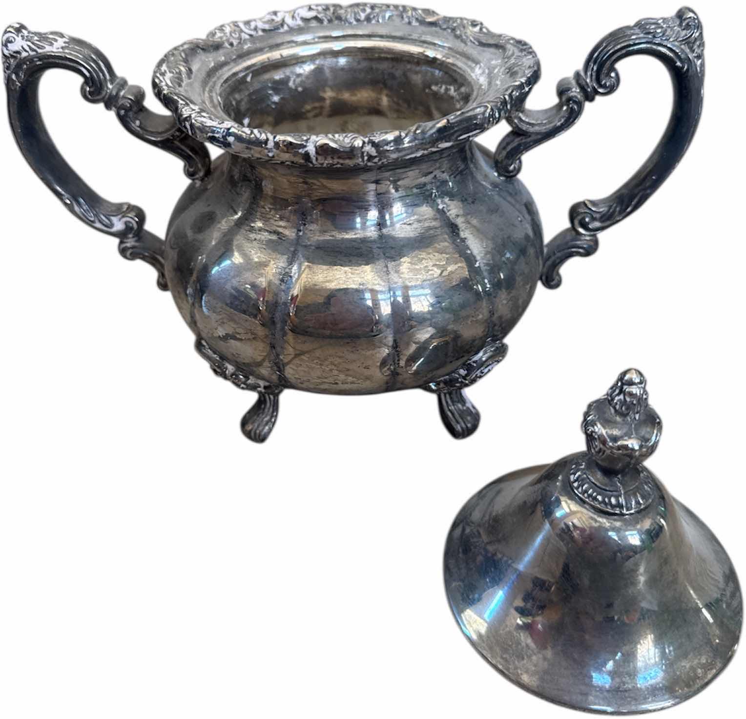 Photo 1 of 2- ANTIQUE SILVER PLATED WATER PITCHER AND SHEFFIELD SUGAR BOWL WITH LID

H8.25” AND SMALLER