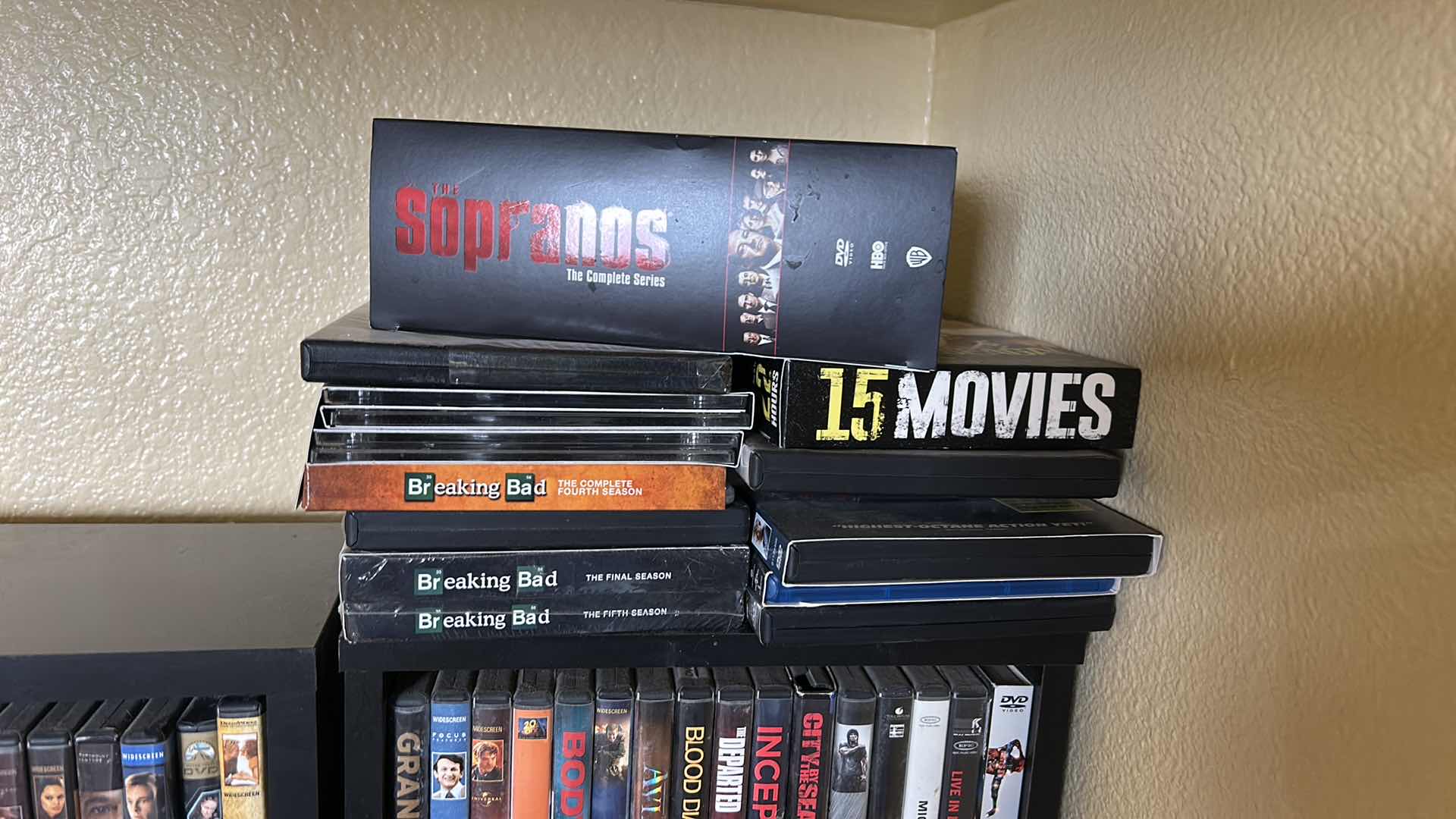 Photo 1 of 2 BLACK SHELVING UNITS WITH DVD’s