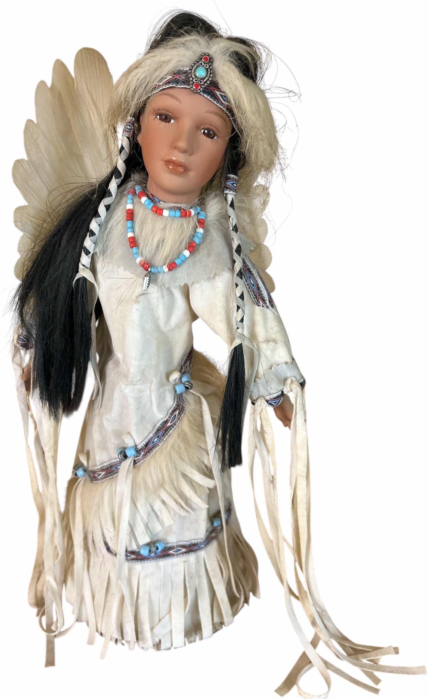 Photo 1 of BATTERY OPERATED HOLLOE BODY PORCELAIN NATIVE AMERICAN DOLL H15”