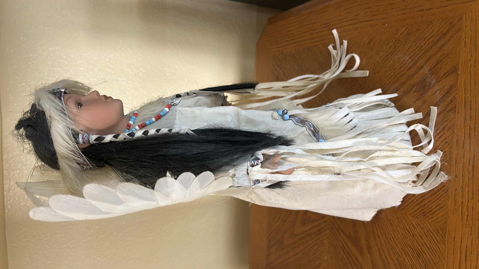 Photo 1 of BATTERY OPERATED HOLLOE BODY PORCELAIN NATIVE AMERICAN DOLL H15”