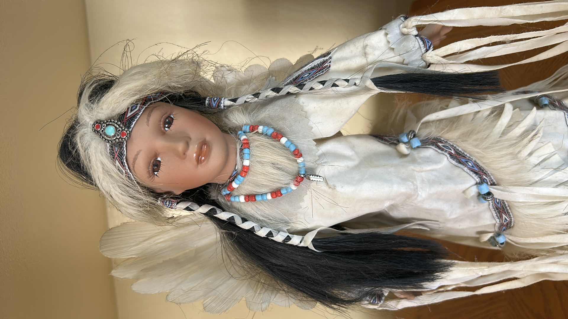 Photo 1 of BATTERY OPERATED HOLLOE BODY PORCELAIN NATIVE AMERICAN DOLL H15”