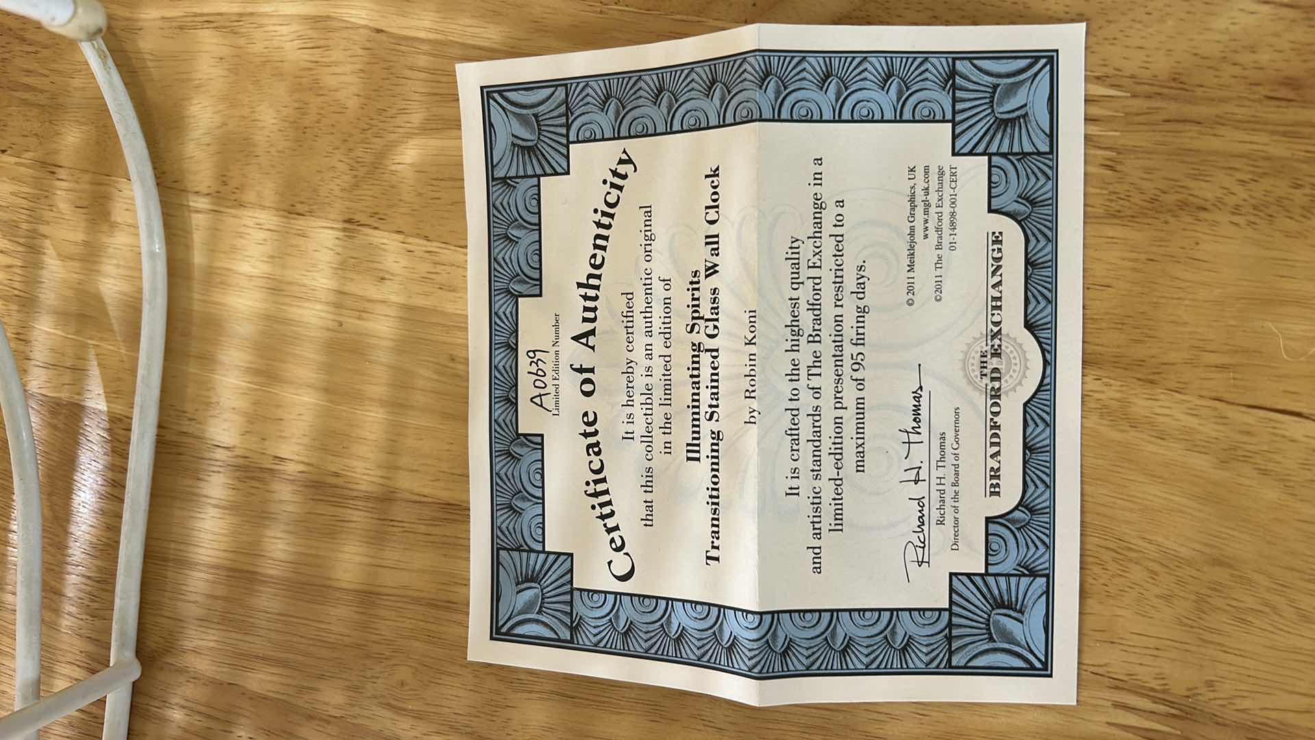 Photo 1 of BRADFORD EXCHANGE NUMBERED ILLUMINATING SPIRITS TRANSITIONING STAINED GLASS WALL CLOCK WITH COA 18”