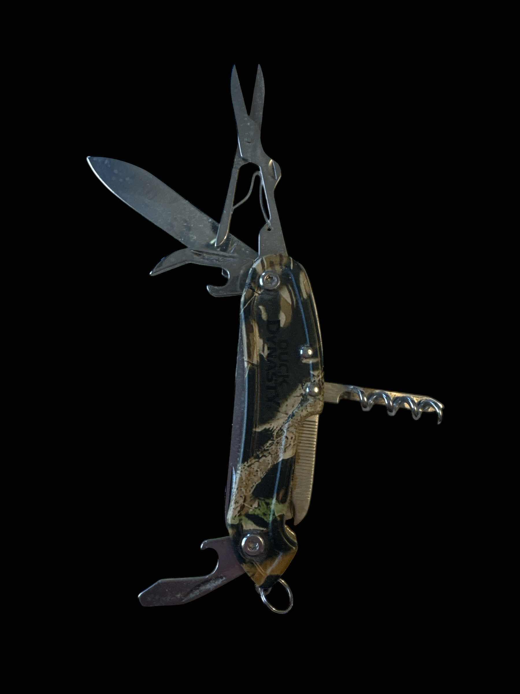 Photo 1 of 2 POCKET KNIVES MULTI-TOOL, COLOMBIA AND DUCK DYNASTY 

H3.5”