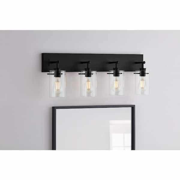Photo 1 of HAMPTON BAY 29.24” REGAN MATTE BLACK 4 LIGHT BATHROOM VANITY LIGHT W CLEAR GLASS SHADES MODEL DSHD19574V3 29.1” X 6.2” H10.3”