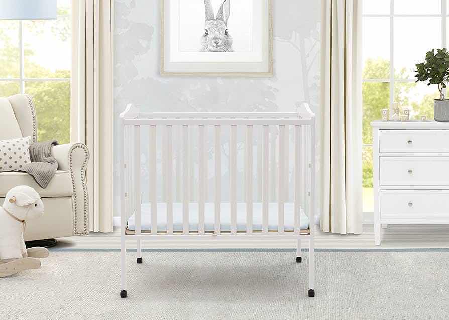 Photo 2 of DELTA CHILDREN WHITE FINISH PORTABLE CRIB W MATTRESS MODEL 4470-100