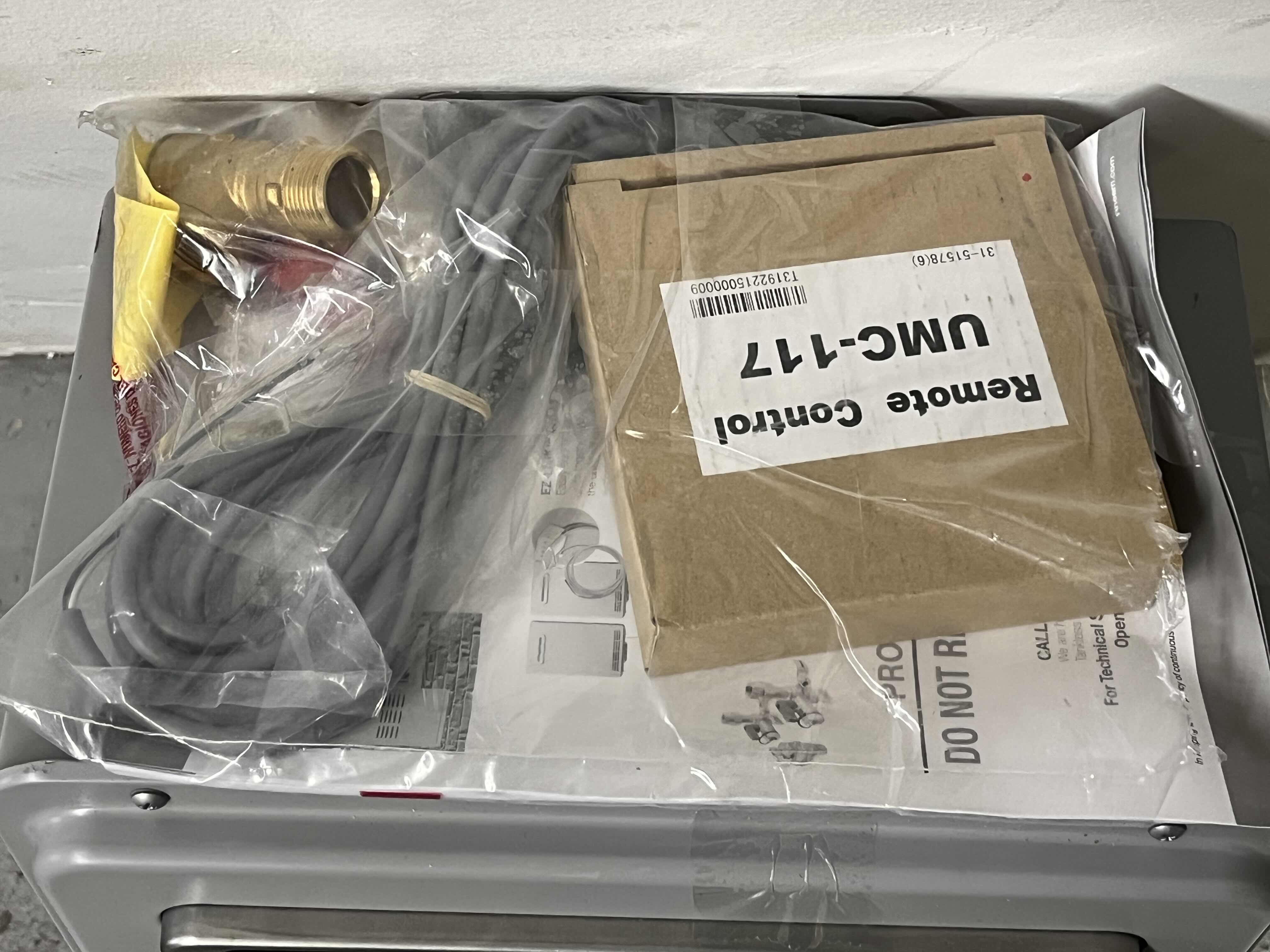 Photo 1 of RHEEM PERFORMANCE PLUS TANKLESS WATER HEATER MODEL ECO200XLN3-1