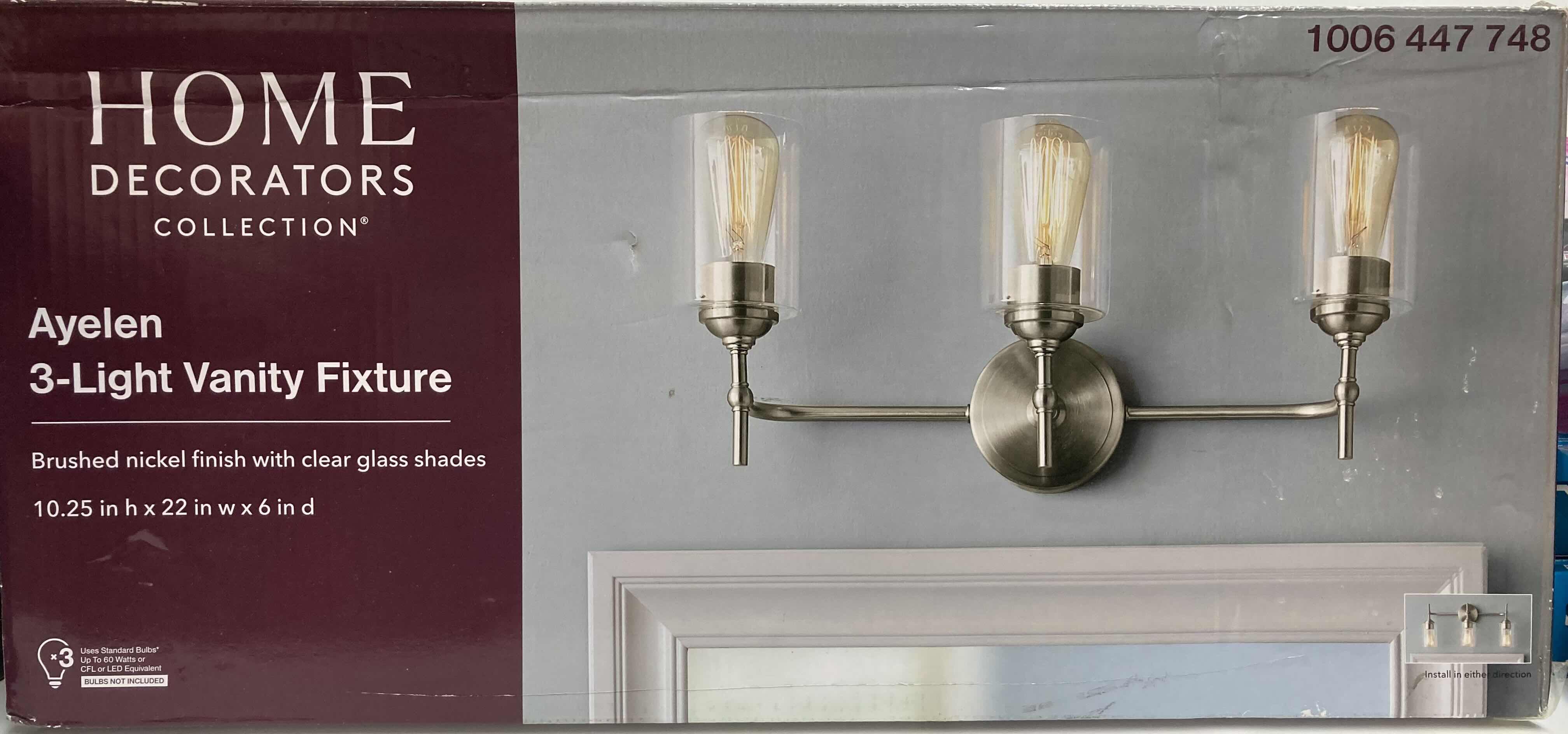 Photo 1 of HOME DECORATORS COLLECTION AYELEN BRUSHED NICKEL FINISH 3-LIGHT VANITY FIXTURE W CLEAR GLASS SHADE MODEL 39109-HBU 22” X 6” H10.25”