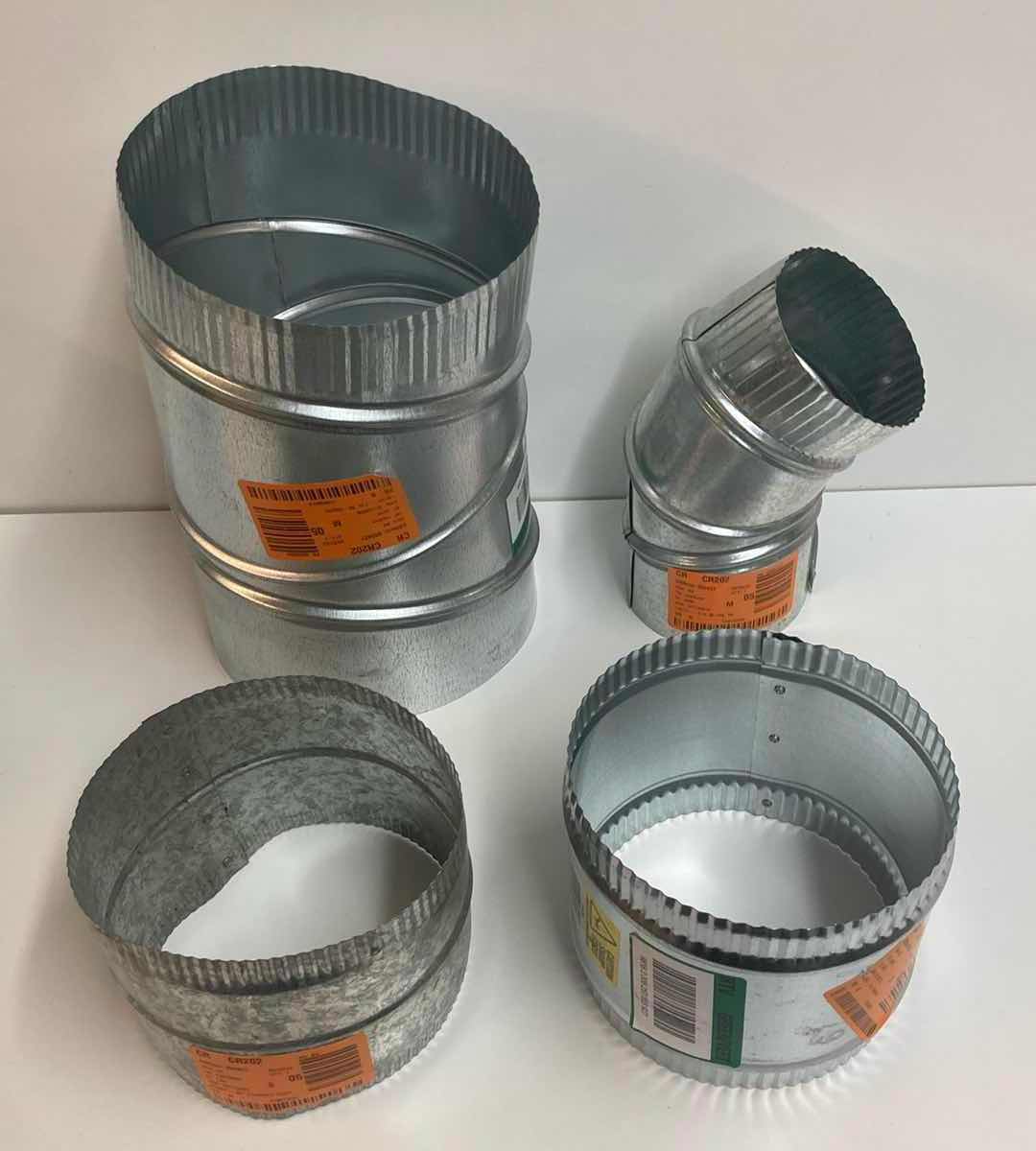 Photo 1 of MASTER FLOW GALVANIZED STEEL DUCT PIPE-ROUND ADJUSTABLE ELBOW 7” 90 DEG, ROUND ADJUSTABLE ELBOW 4” 90 DEG, & 2 FLEXIBLE SHEET METAL CONNECTOR SPLICE COLLAR 6”