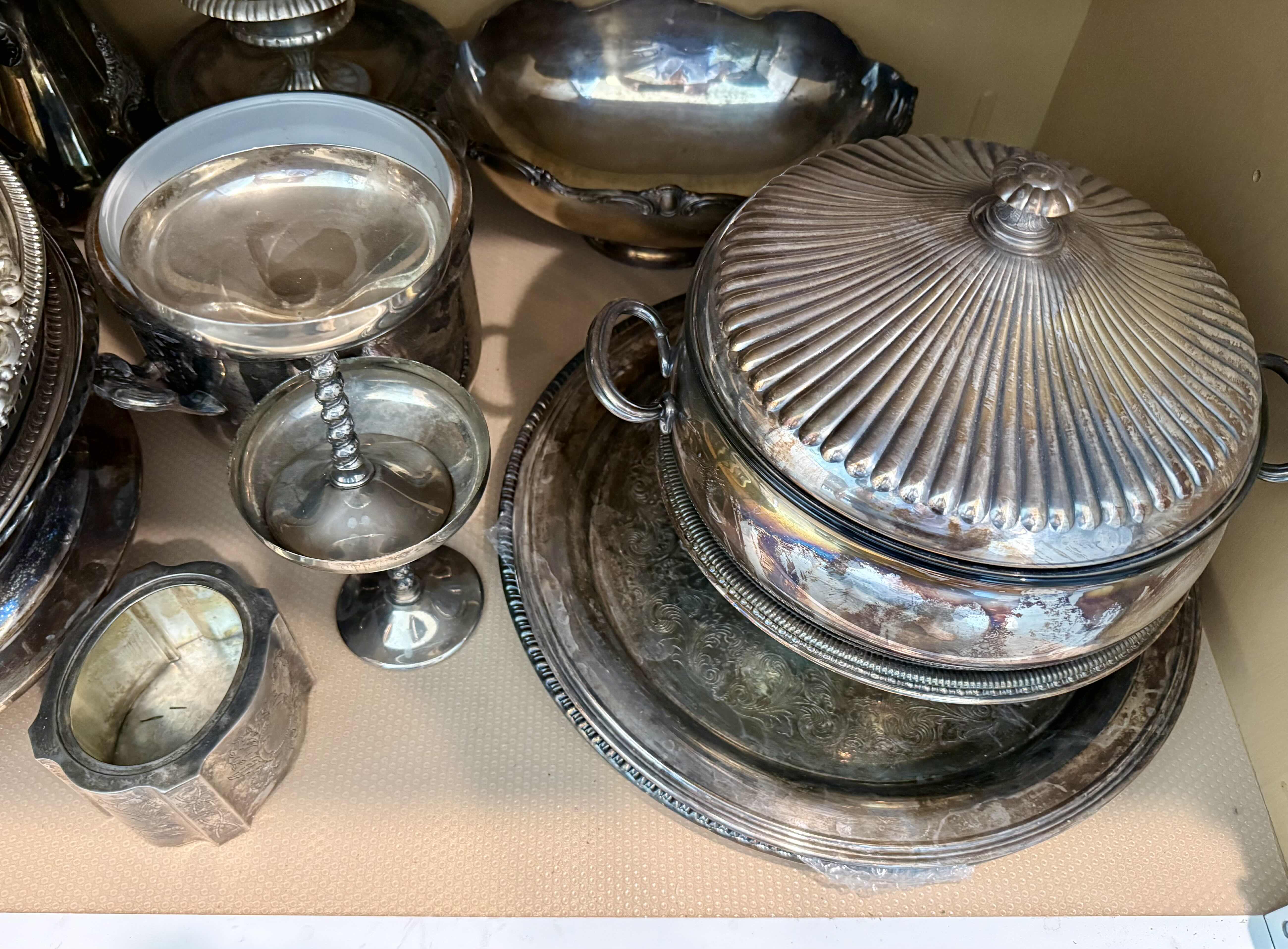 Photo 1 of CONTENTS OF KITCHEN CABINET-SILVER-PLATED SERVE-WARE