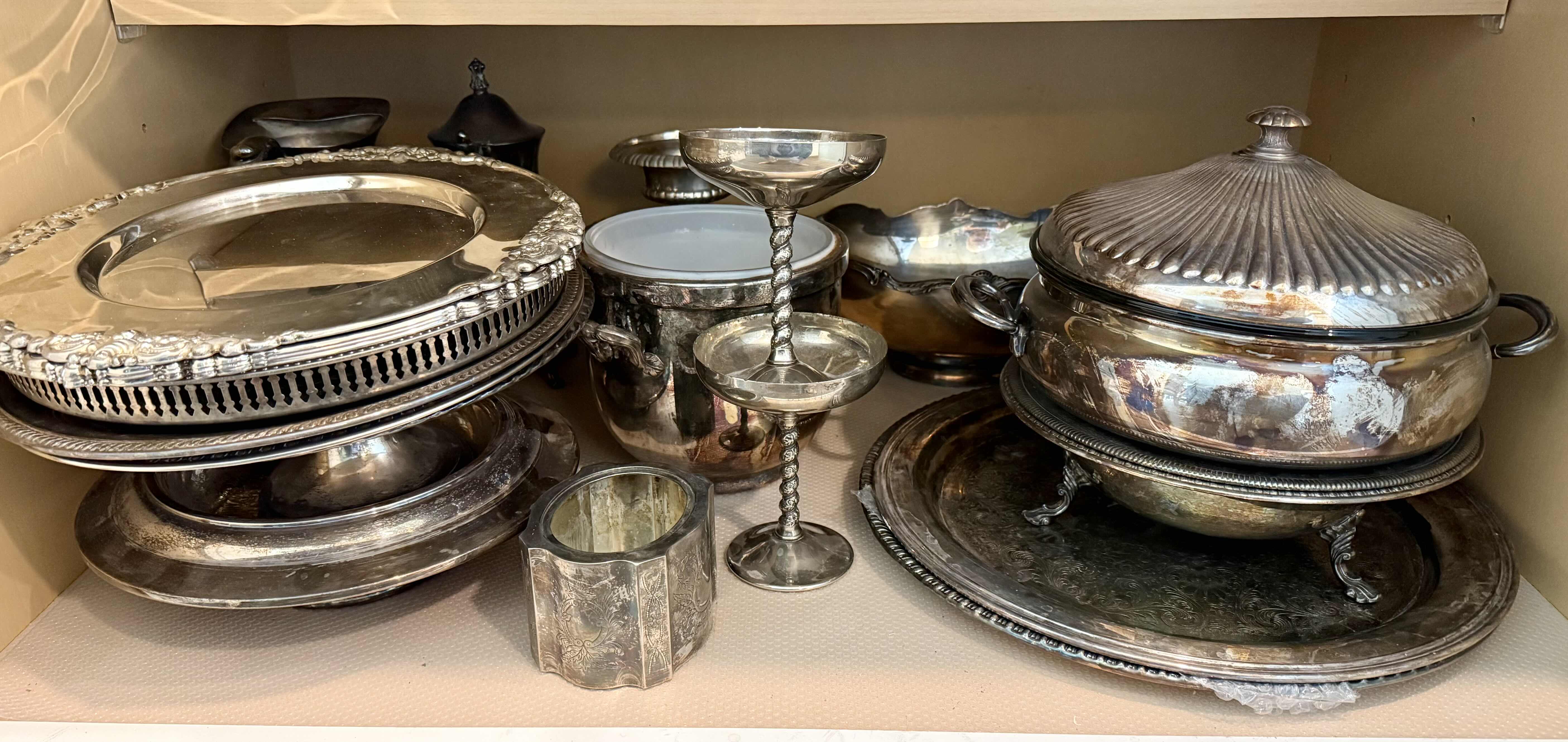 Photo 1 of CONTENTS OF KITCHEN CABINET-SILVER-PLATED SERVE-WARE