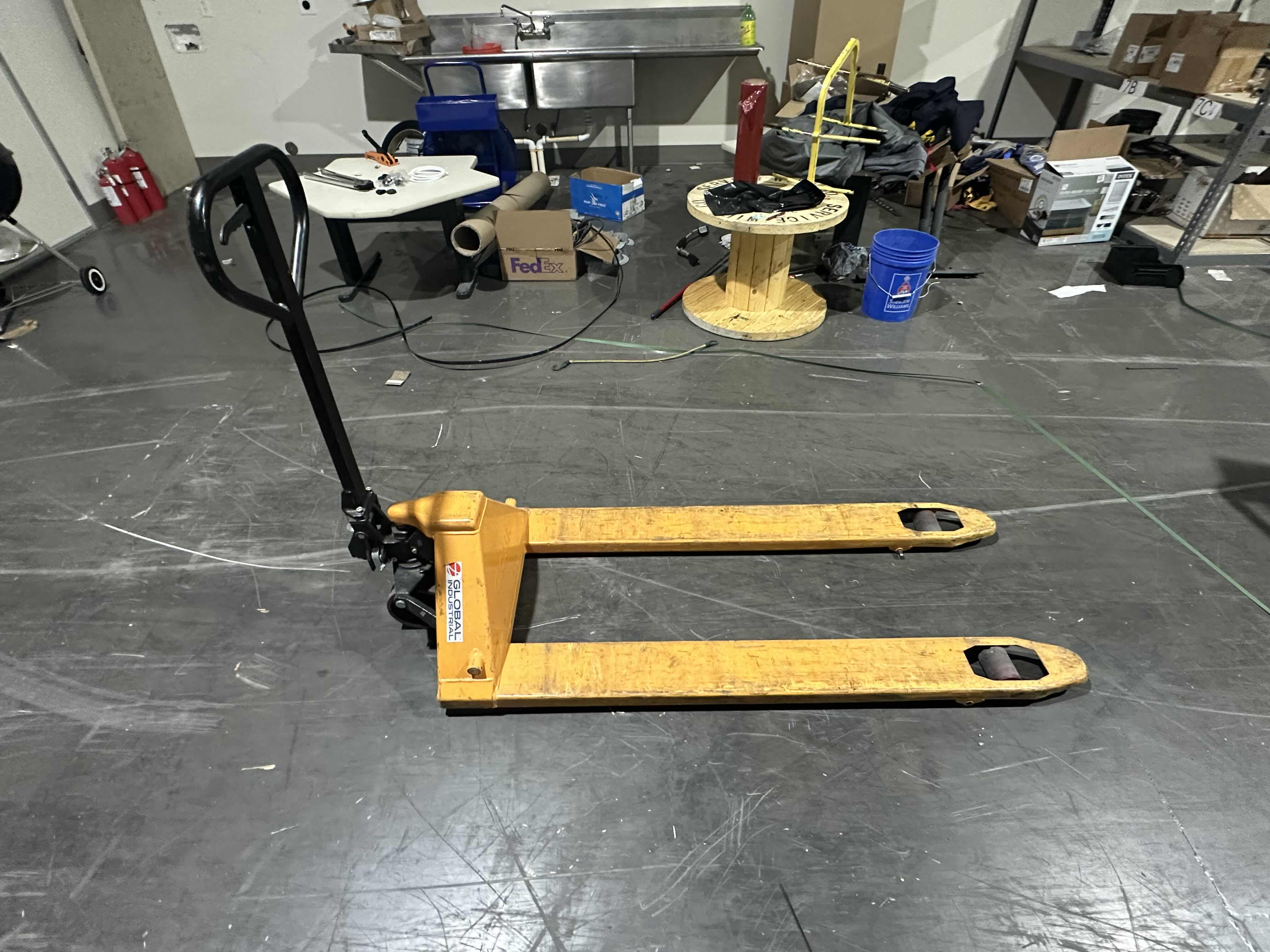 Photo 1 of GLOBAL INDUSTRAL PALLET JACK TRUCK