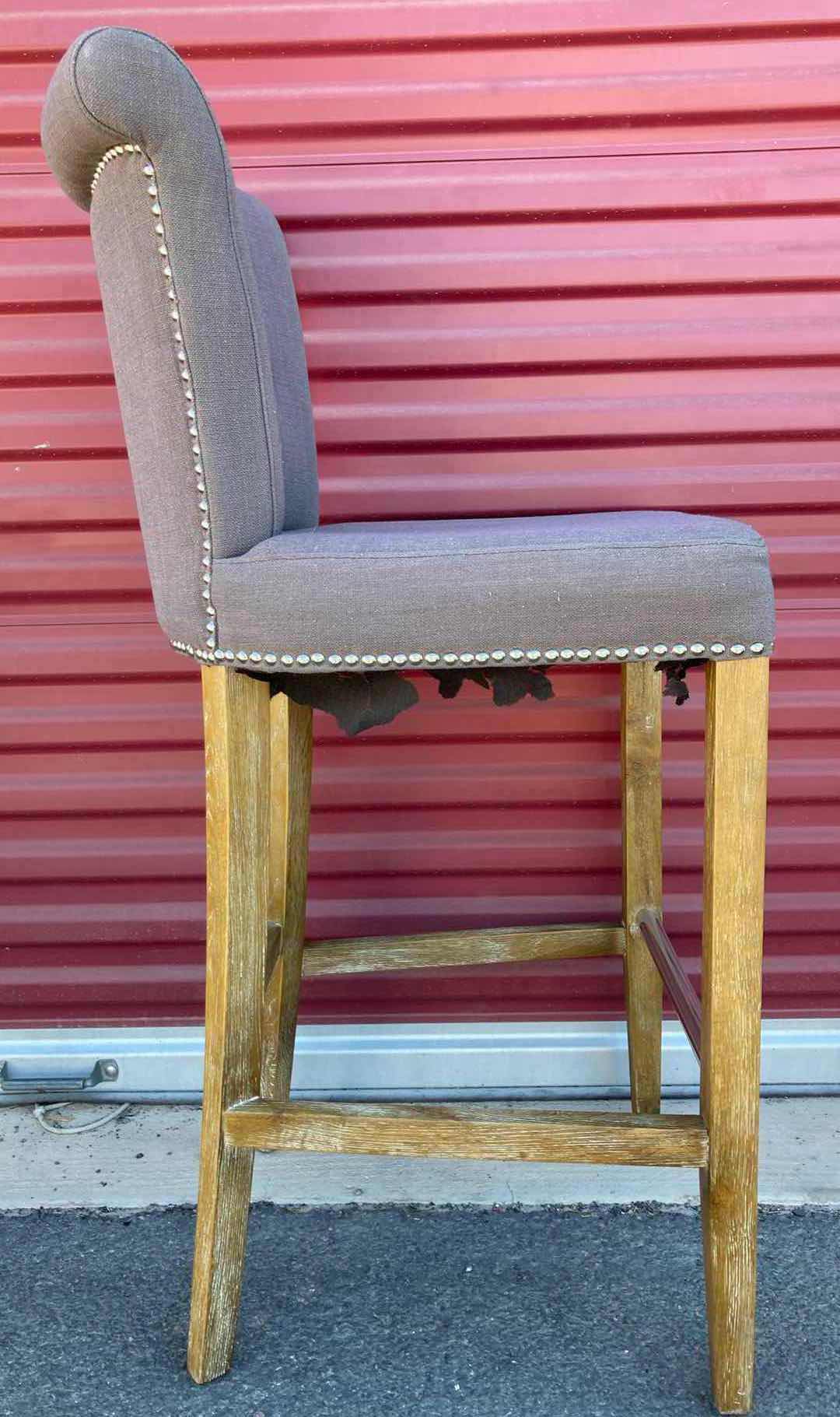 Photo 1 of GREY UPHOLSTERY COUNTER HEIGHT ARMLESS CHAIR W NAIL TRIM & WOOD LEGS 19” X 19” H42.5”