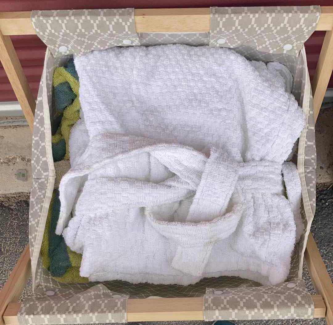 Photo 1 of CLOTHES HAMPER, CONTENTS INCLUDED- TOWELS, RUG & ROBE