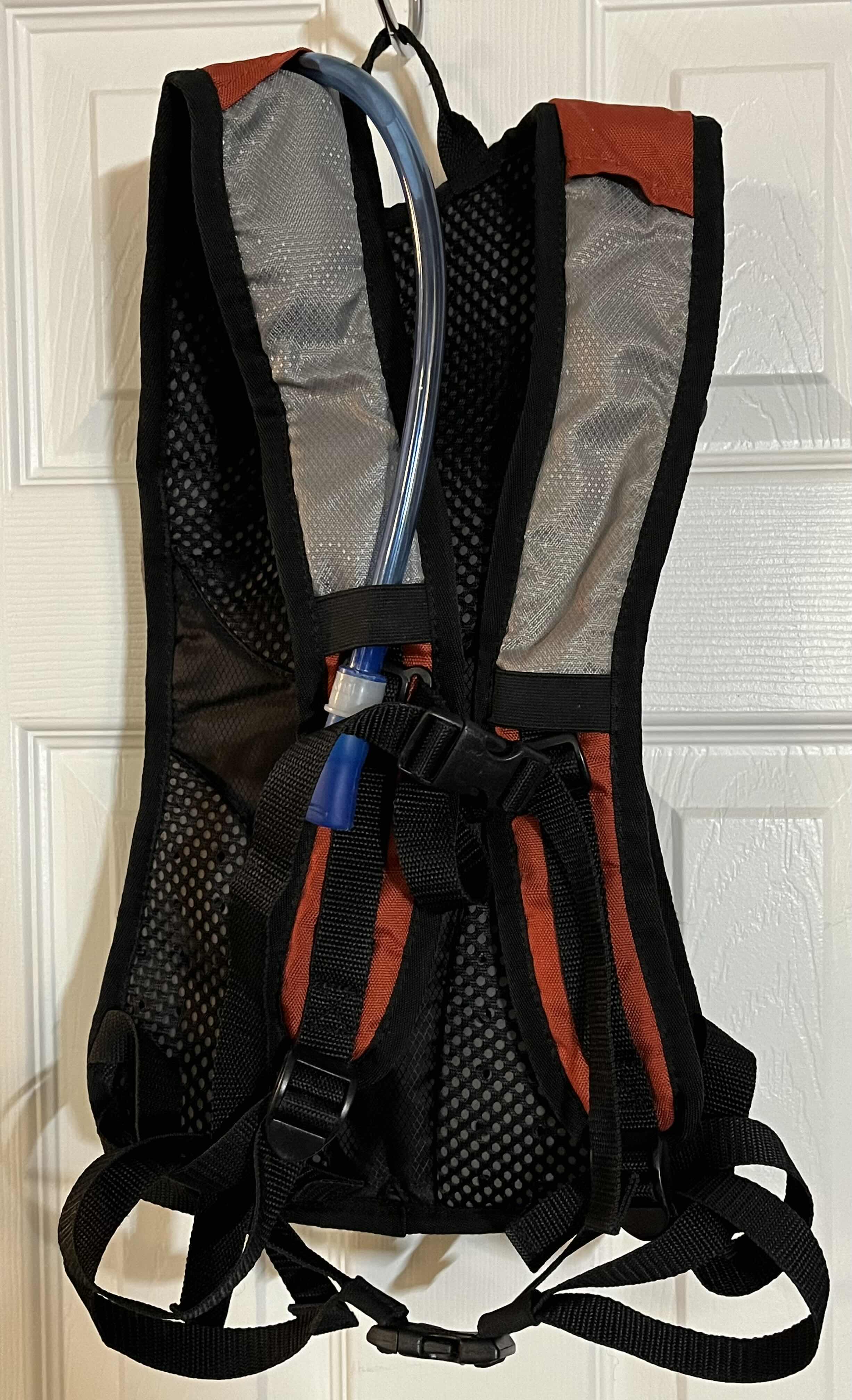 Photo 1 of COLEMAN REVEL 8L ORANGE & GRAY HYDRATION BACKPACK W 2LITER BLADDER