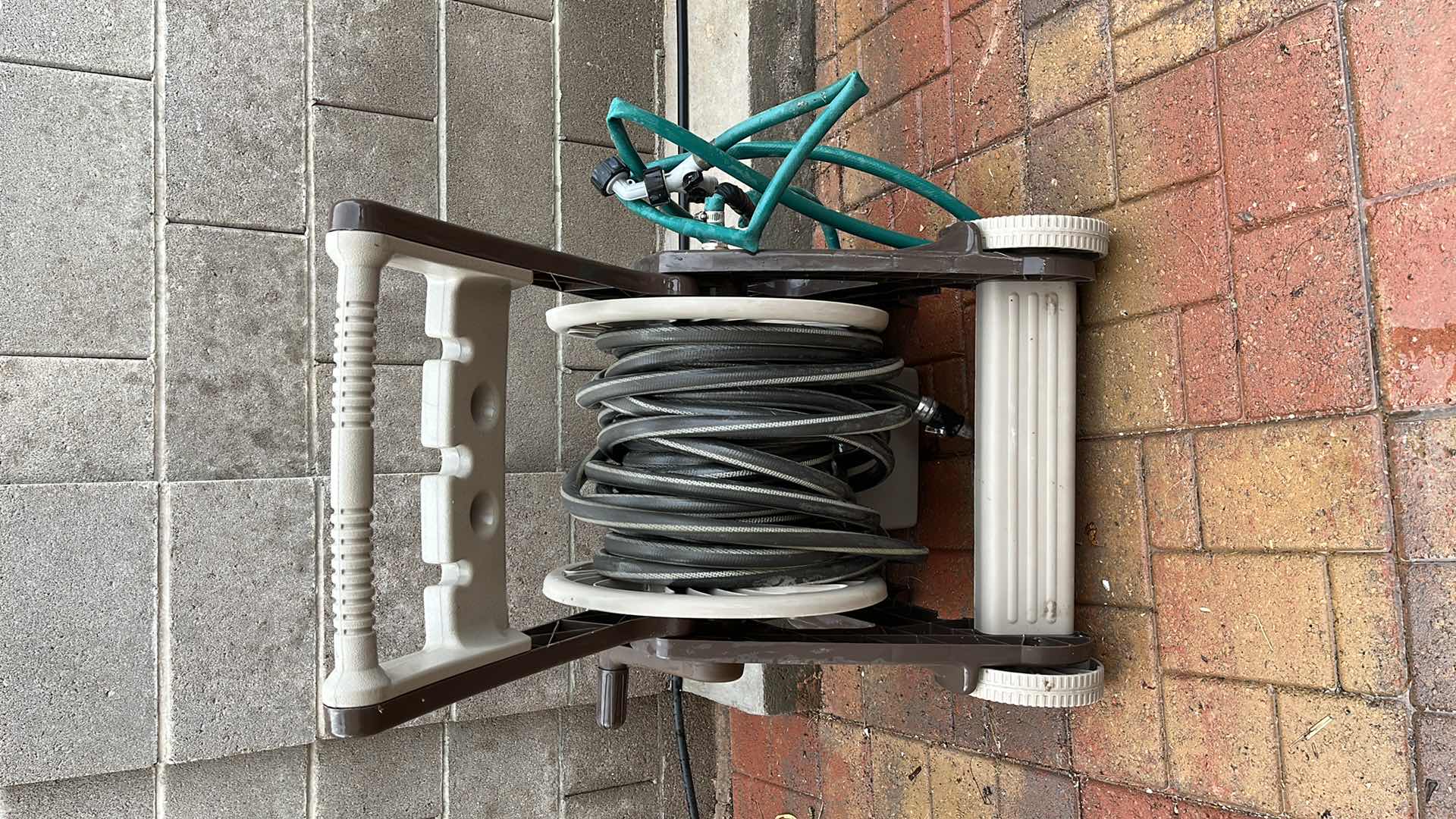 Photo 1 of AMES GARDEN HOSE REEL W HOSE NOZZLE ATTACHMENTS (4)