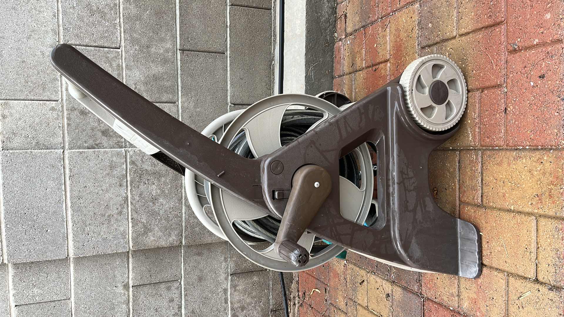 Photo 1 of AMES GARDEN HOSE REEL W HOSE NOZZLE ATTACHMENTS (4)