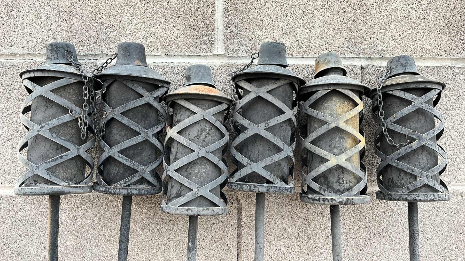View 2 of WROUGHT IRON STYLE TIKI TORCHES (6) H72” W 3 TIKI FUEL 3QT JUGS