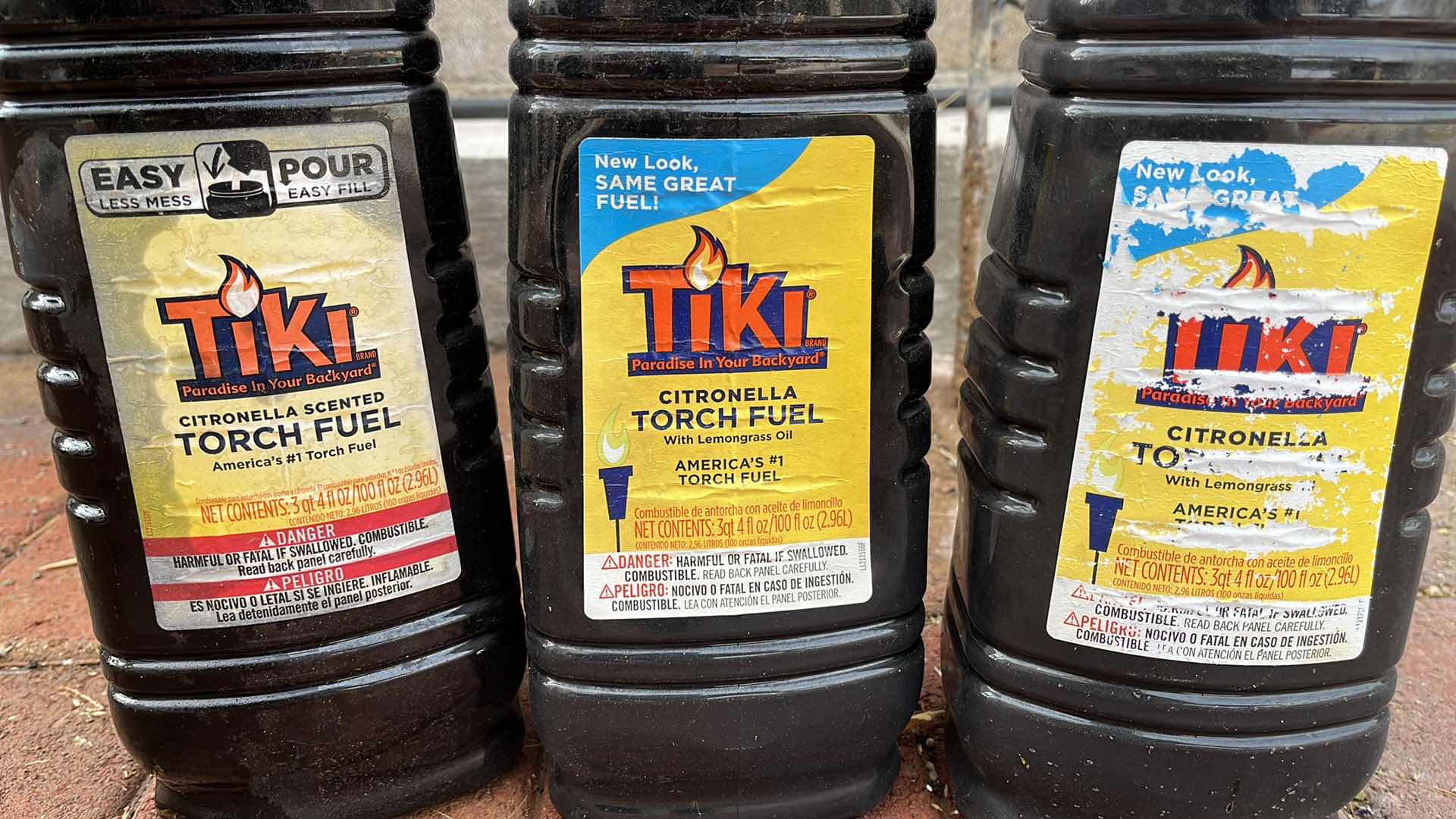 View 5 of WROUGHT IRON STYLE TIKI TORCHES (6) H72” W 3 TIKI FUEL 3QT JUGS