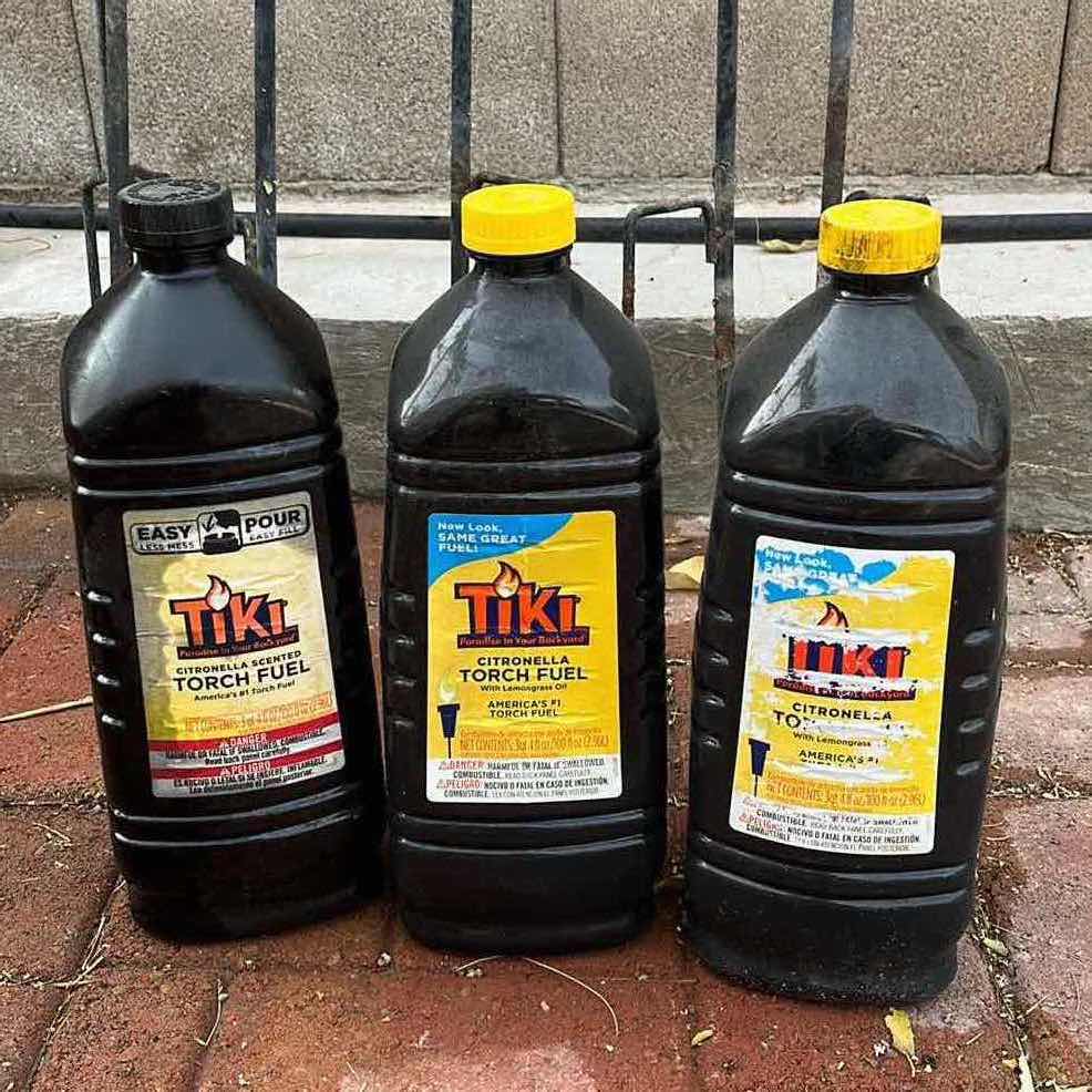 View 4 of WROUGHT IRON STYLE TIKI TORCHES (6) H72” W 3 TIKI FUEL 3QT JUGS