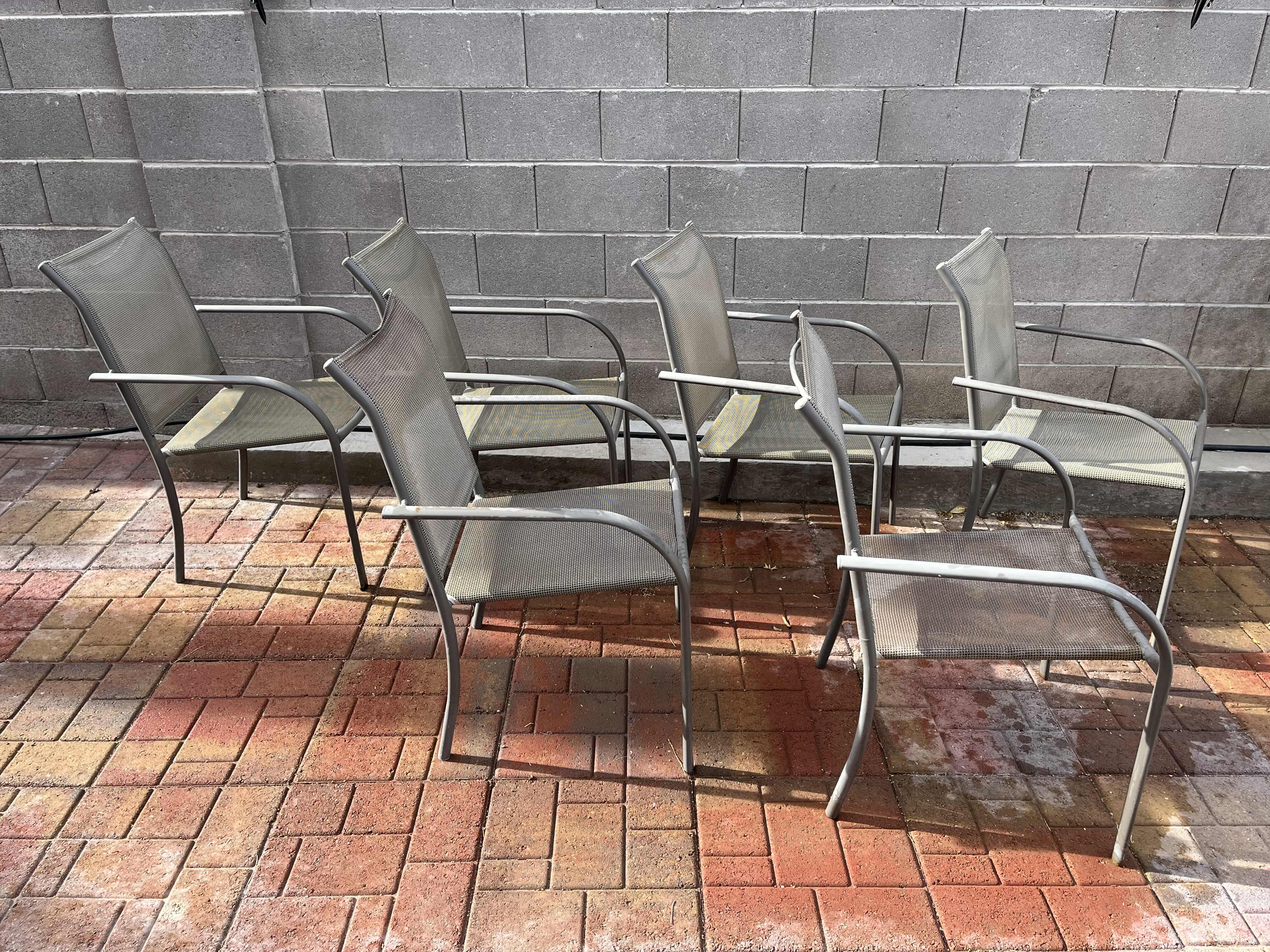 Photo 1 of PATIO GLASS TOP TABLE 60” X 38” H28.5” W MESH CHAIRS (6)