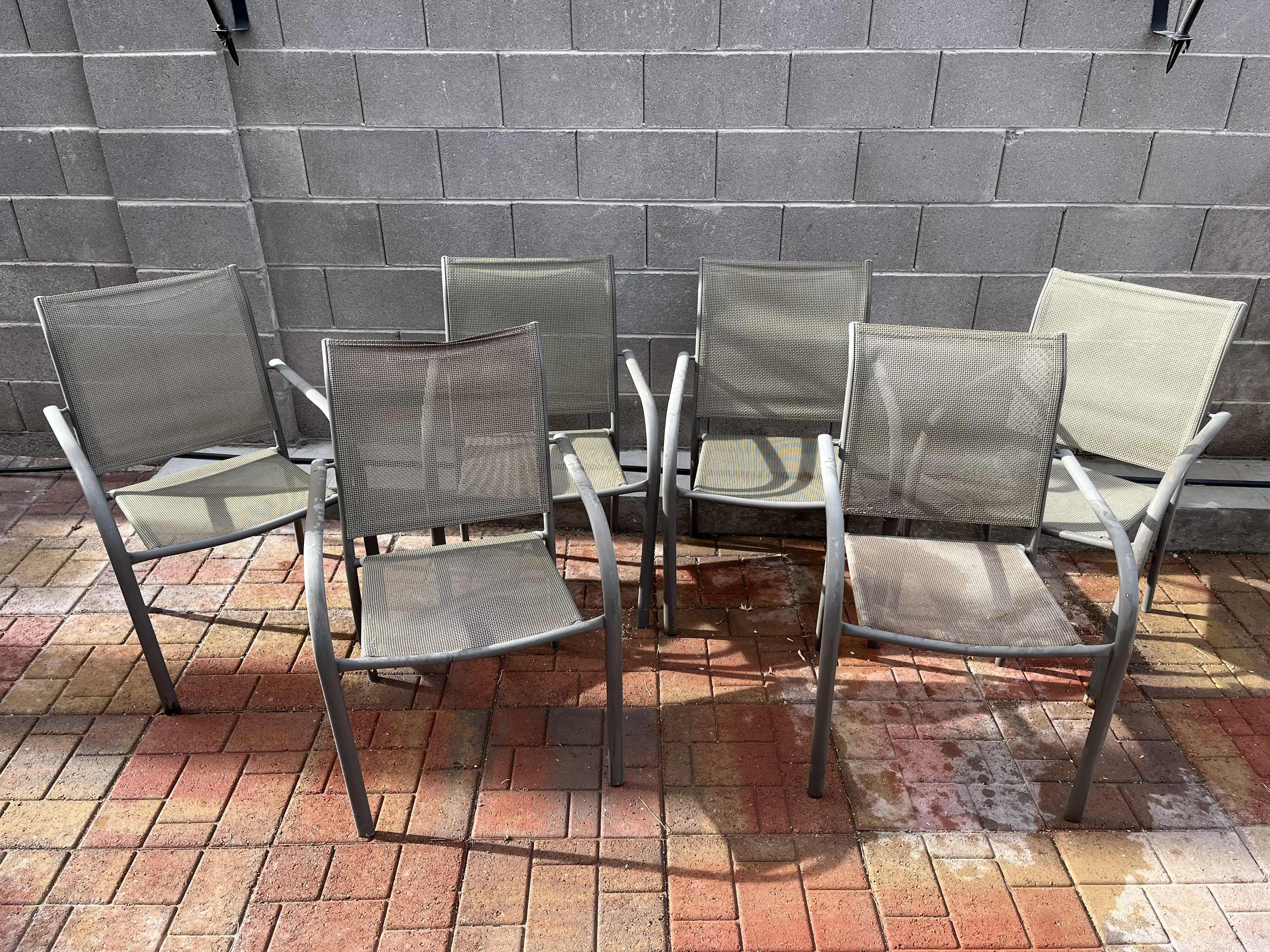 Photo 1 of PATIO GLASS TOP TABLE 60” X 38” H28.5” W MESH CHAIRS (6)