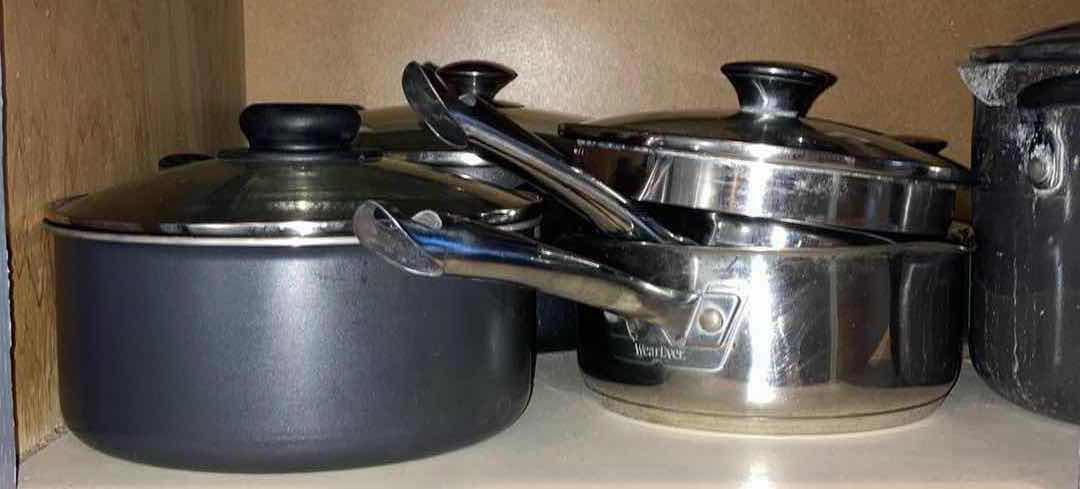 Photo 1 of CONTENTS OF CABINET- POTS & PANS W LIDS