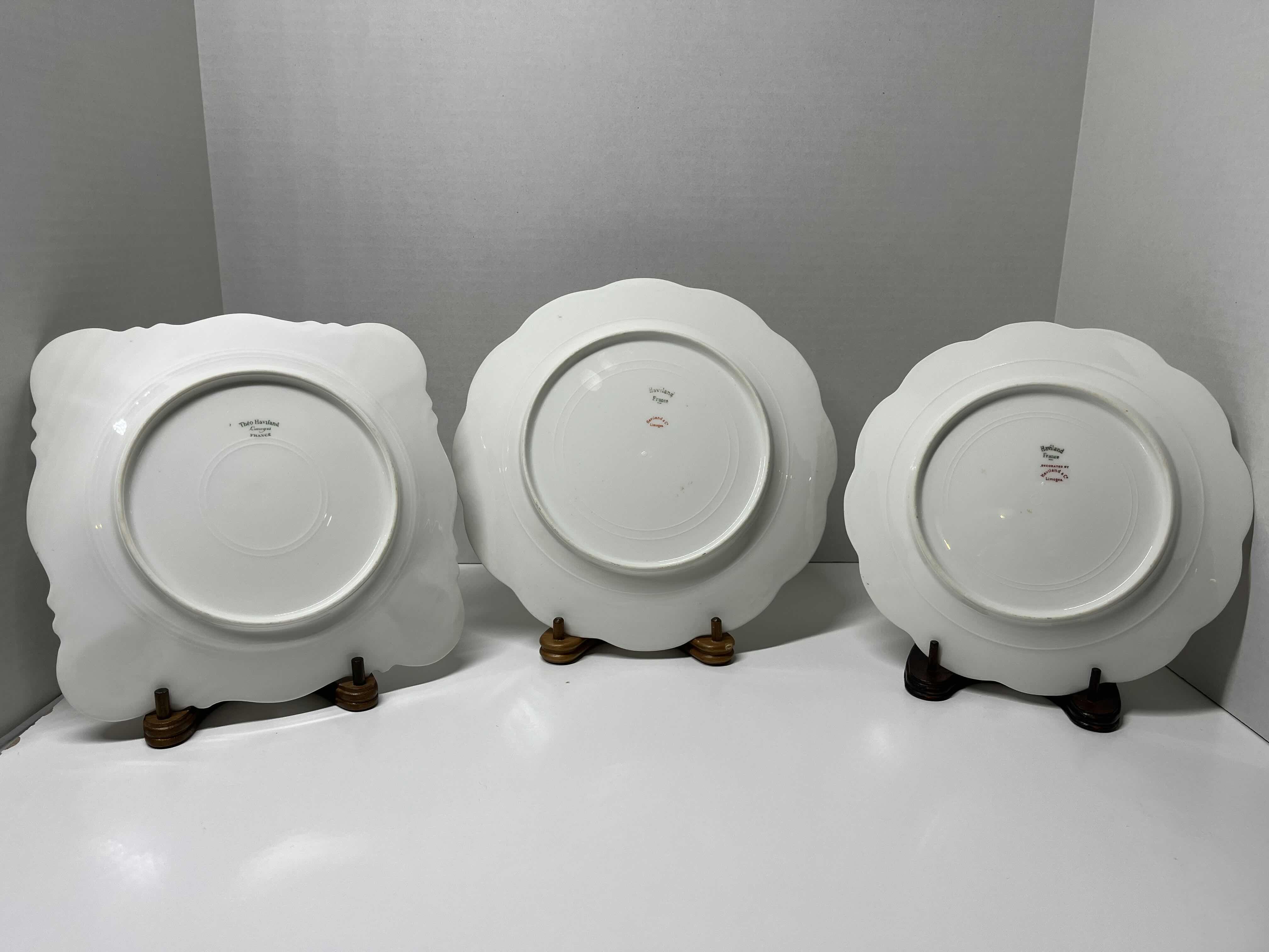 Photo 1 of ANTIQUE THEODORE HAVILAND LIMOGES FRANCE PINK, GREEN & GOLD EMBOSSED FLORAL DESIGN FINE CHINA PLATE SET (3) W WOOD DISPLAY STANDS (3)