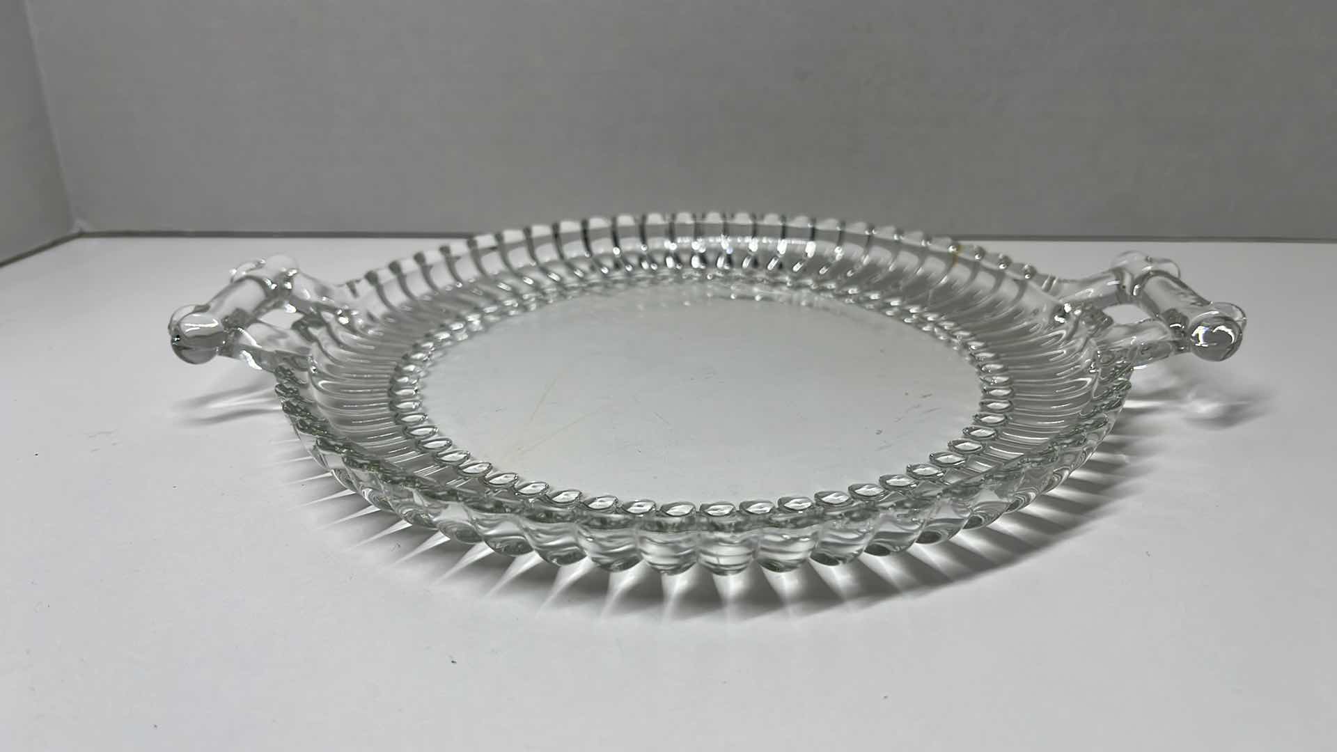 Photo 1 of JEANNETTE NATIONAL CLEAR GLASS 2 HANDLED PLATE 8” X 9.75”