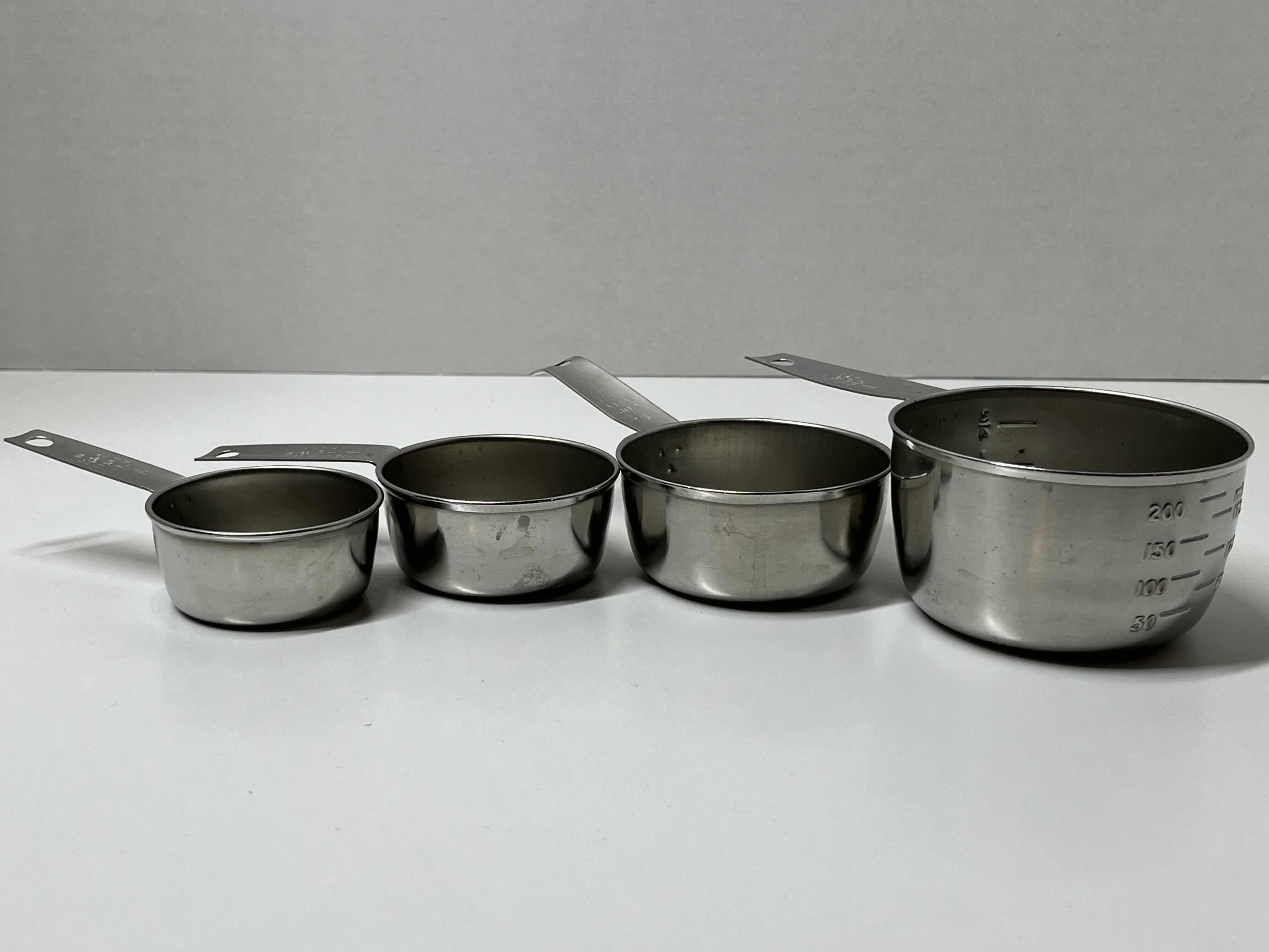 Photo 1 of FOLEY STAINLESS STEEL MEASURING CUP SET (4) 1/4CUP-1CUP