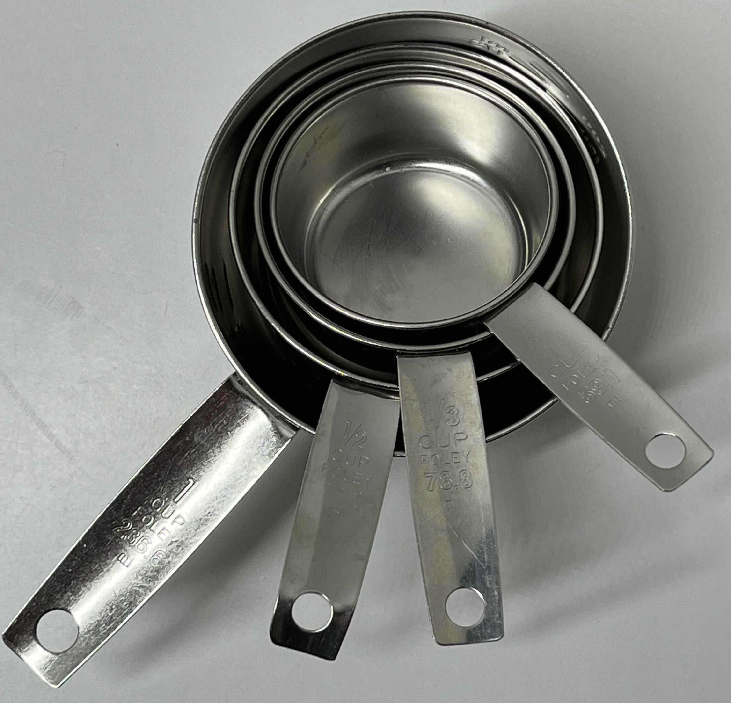 Photo 1 of FOLEY STAINLESS STEEL MEASURING CUP SET (4) 1/4CUP-1CUP