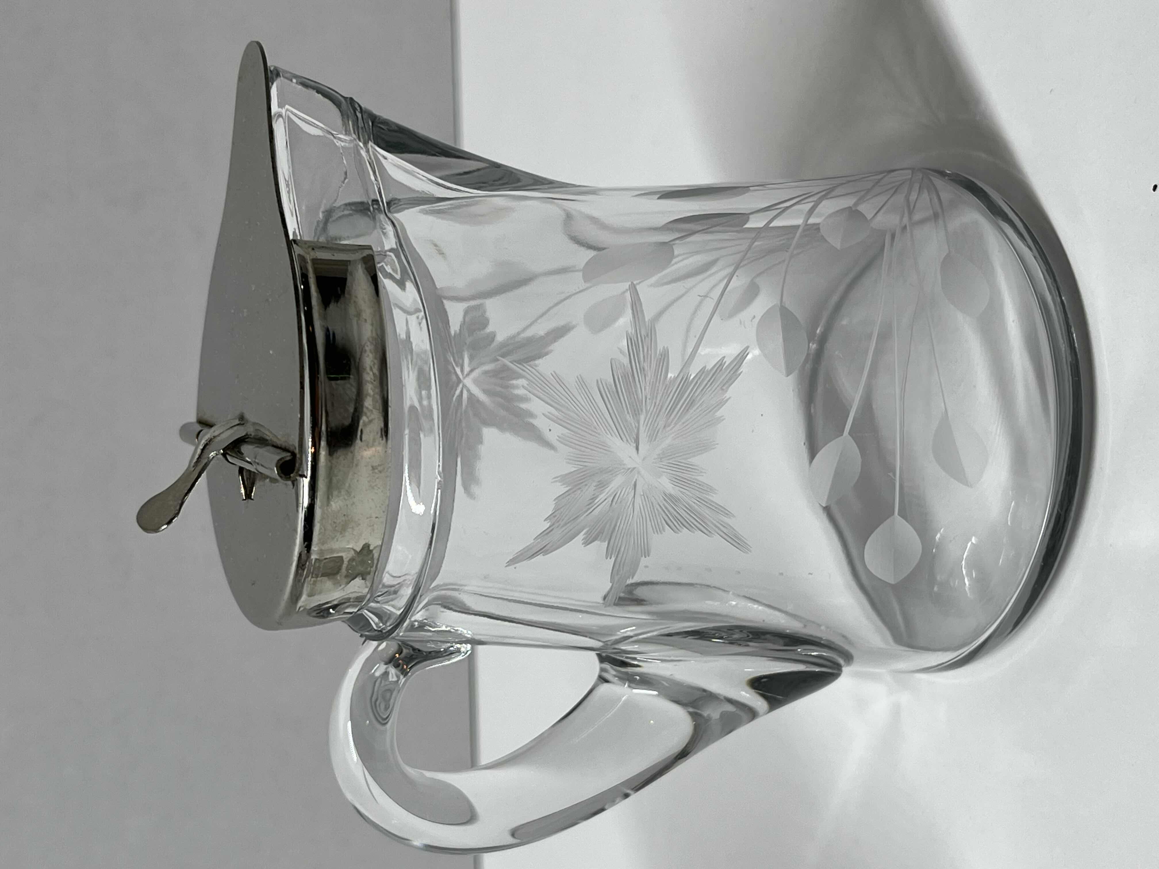 Photo 1 of ETCHED FLORAL DESIGN SYRUP DISPENSER W SPRING ACTION SILVER FINISH LID 4” X 3” H4.5”