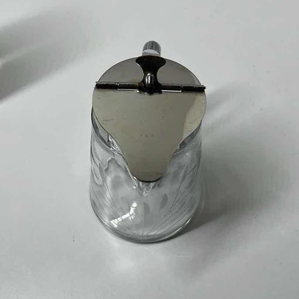 Photo 1 of ETCHED FLORAL DESIGN SYRUP DISPENSER W SPRING ACTION SILVER FINISH LID 4” X 3” H4.5”