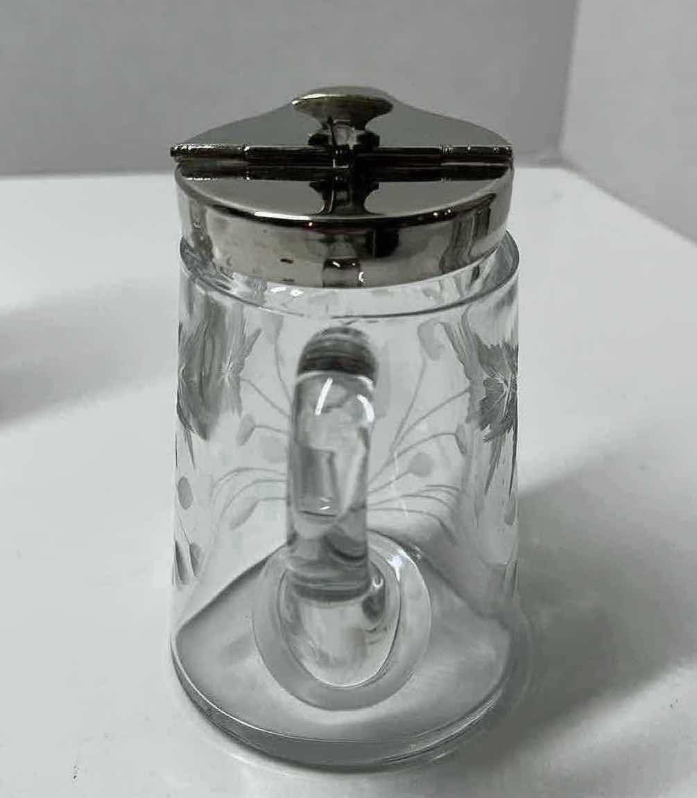 Photo 1 of ETCHED FLORAL DESIGN SYRUP DISPENSER W SPRING ACTION SILVER FINISH LID 4” X 3” H4.5”