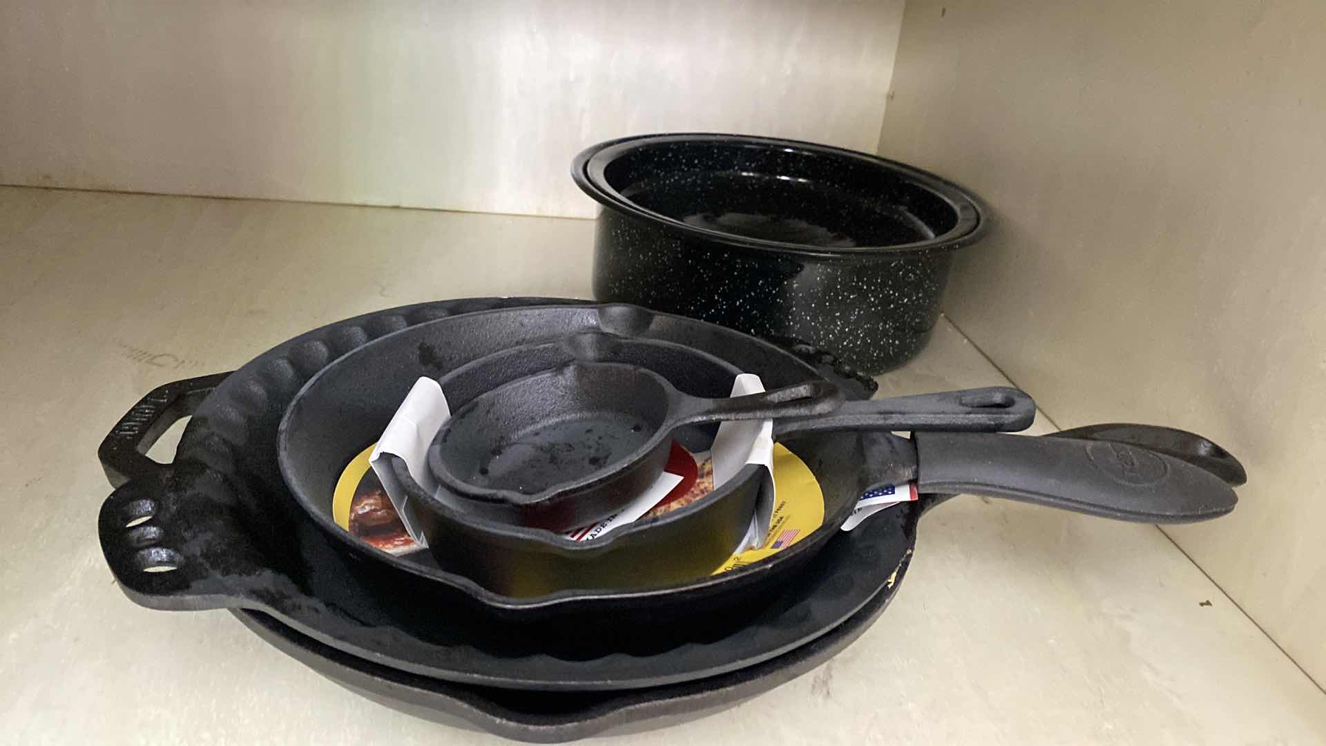 Photo 1 of CONTENTS KITCHEN CABINET CAST IRON PANS AND SMALL ENAMEL ROASTER
