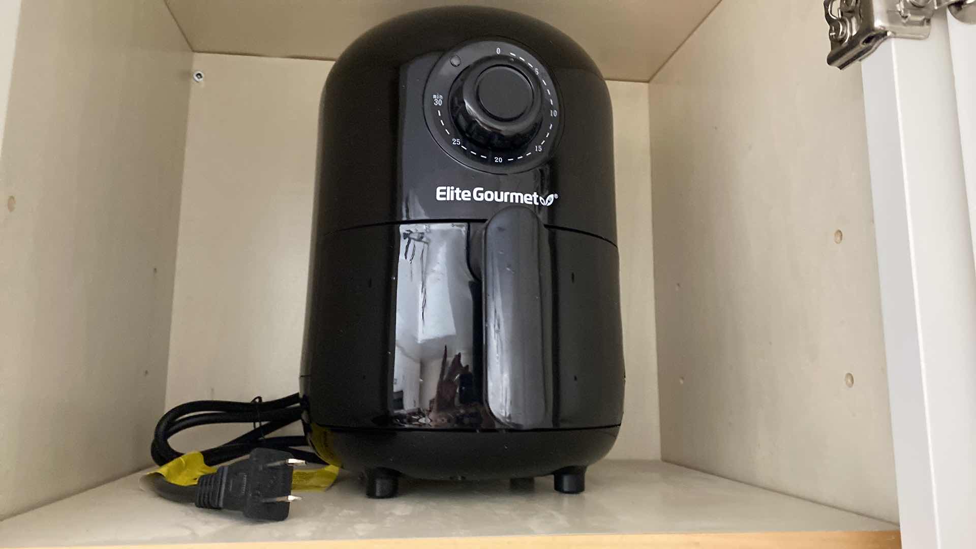 Photo 1 of CONTENTS KITCHEN CABINET ELITE GOURMET AIR FRYER, BLACK AND DECKER TOASTER AND HAND MIXER