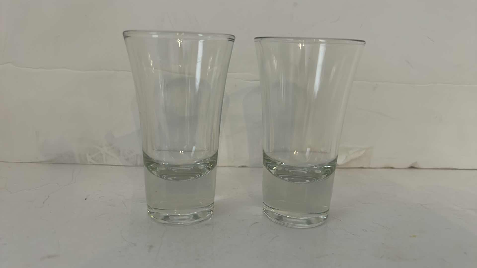 Photo 1 of BLUE GLASS SPHERE AND 2 SHOT GLASSES