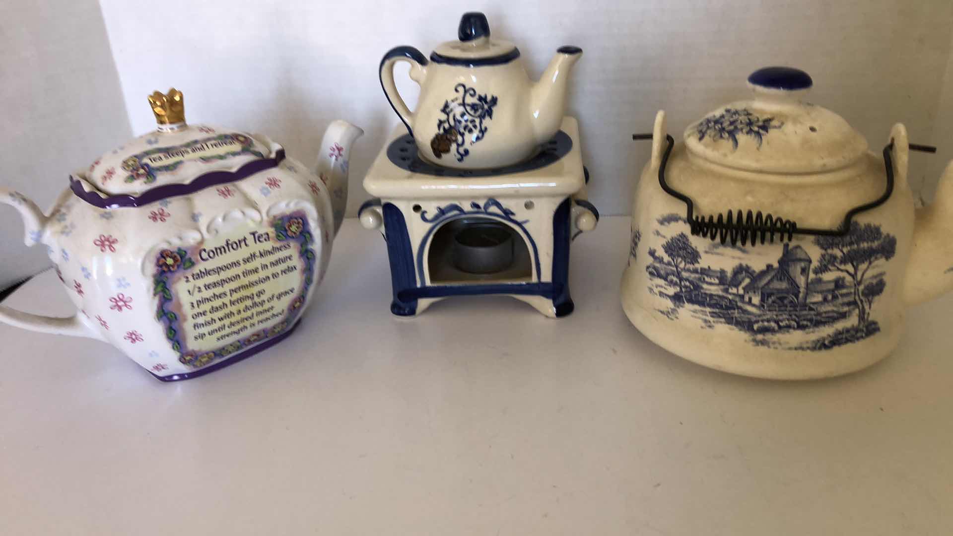 Photo 1 of TEA POTS AND A CANDLE HOLDER