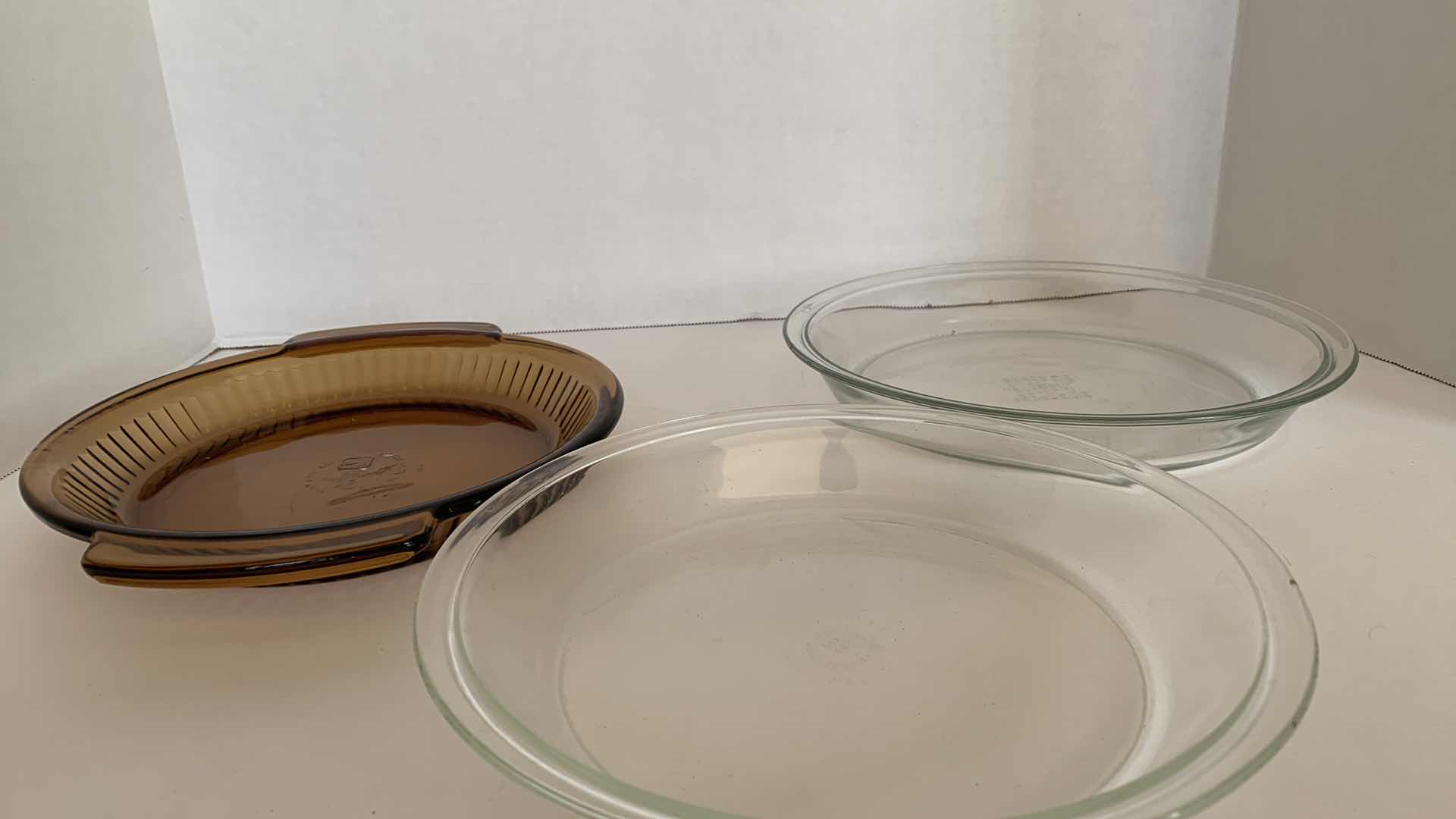 Photo 1 of 2 - 10” PIE PLATES AND 1 - 9” PIE PLATE