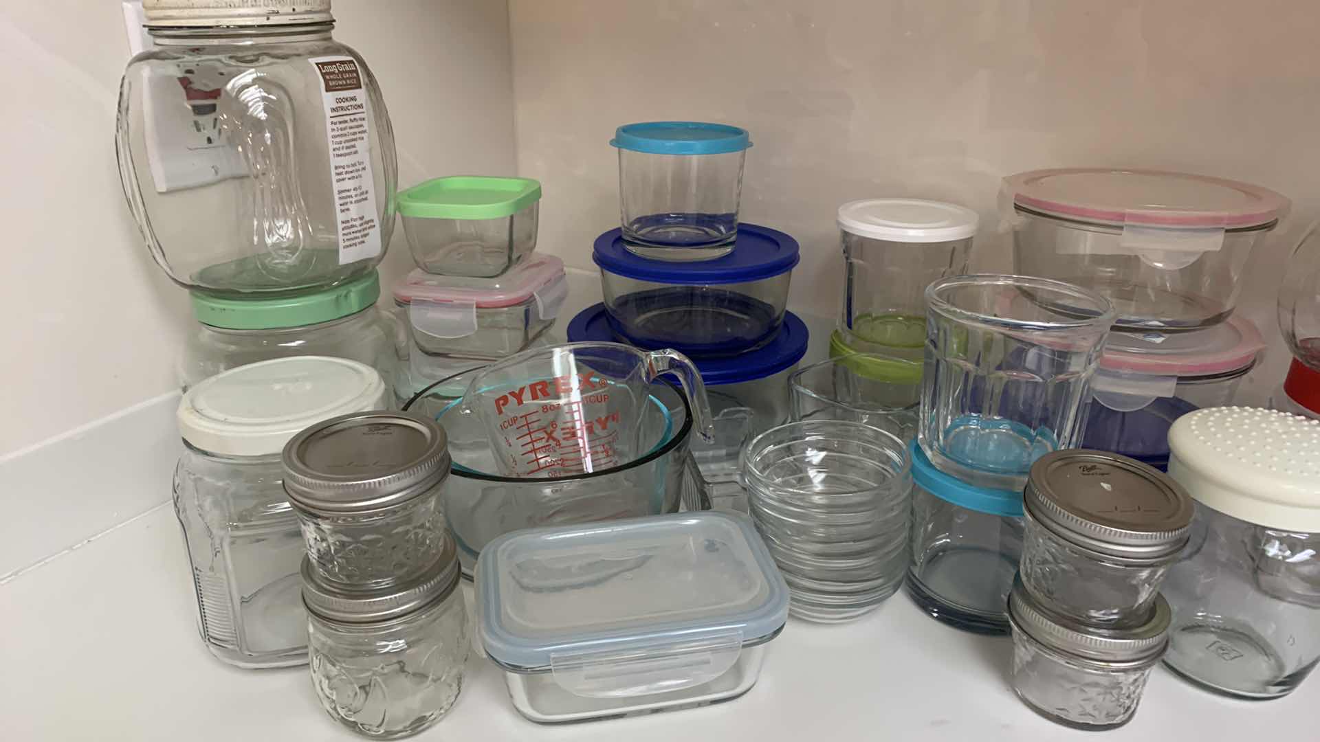 Photo 1 of ASSORTED VINTAGE GLASS JARS ,  STORAGE CONTAINERS AND MORE