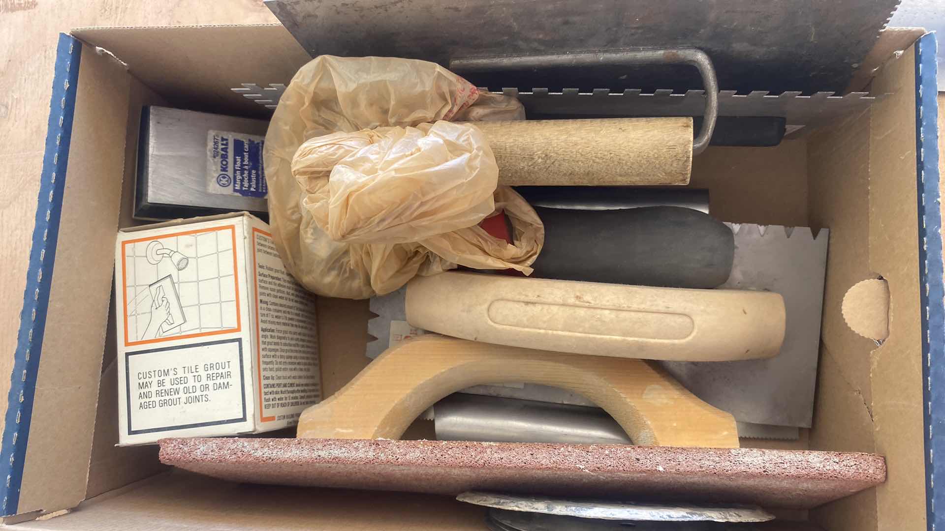 Photo 1 of BOX OF TILE TOOLS AND SPACERS