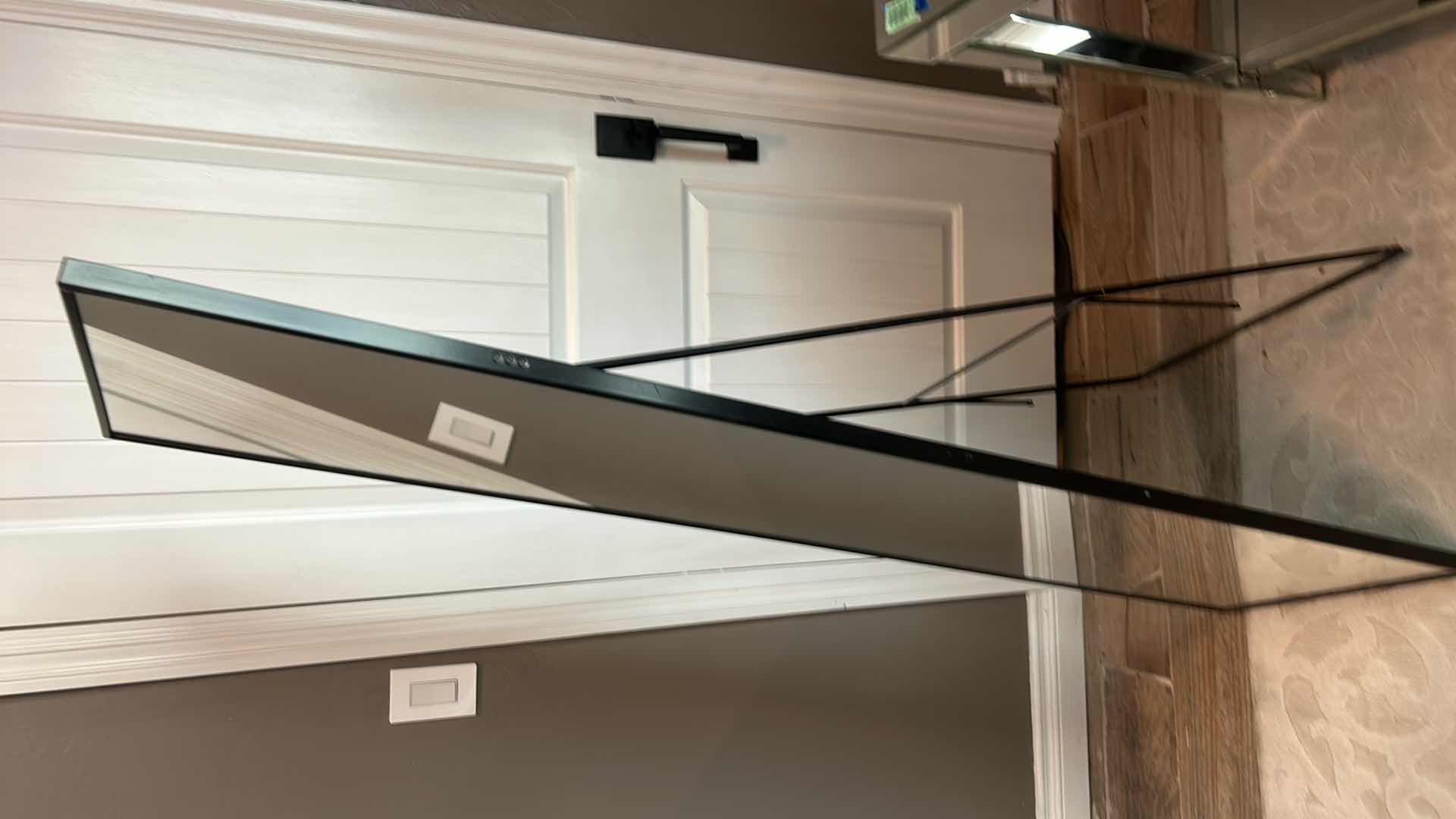 Photo 1 of A MODERN BLACK METAL WARDROBE MIRROR WITH DIMENSIONS OF 40" X H64".
