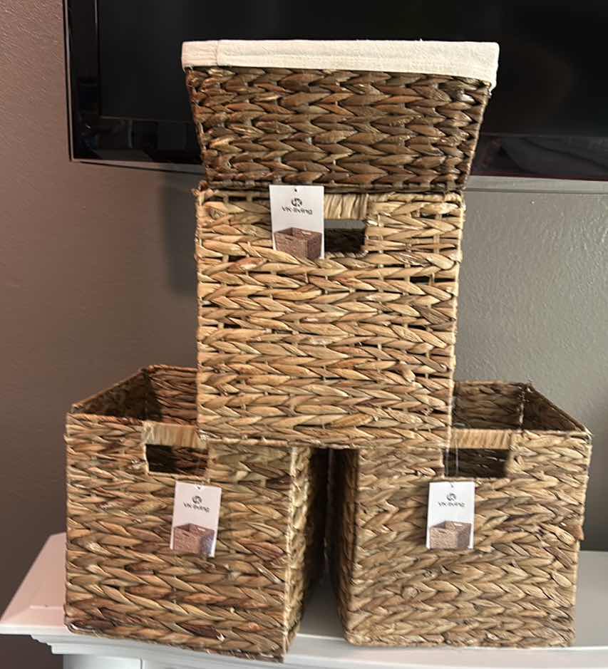 Photo 1 of FOUR WOVEN WICKER STORAGE BASKETS, THREE OF WHICH ARE COLLAPSIBLE.