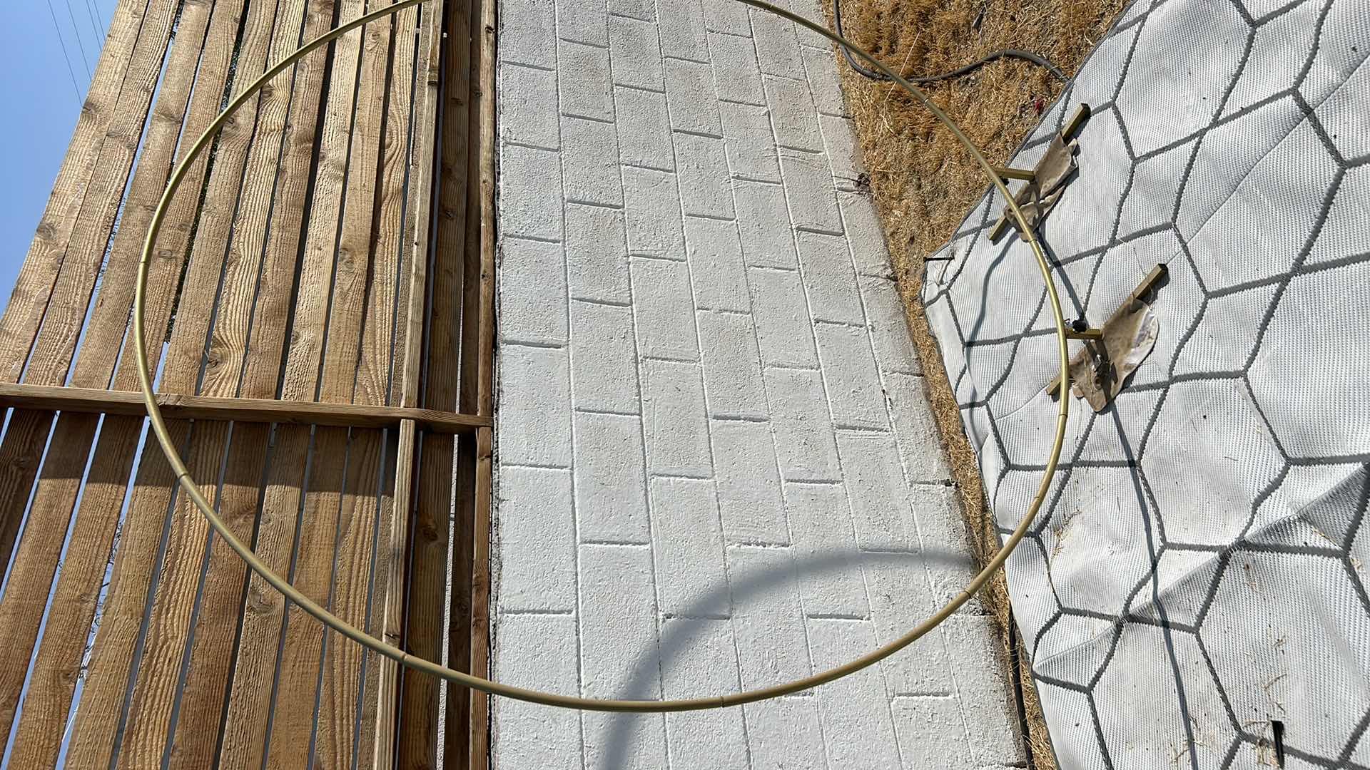 Photo 1 of GOLD CIRCULAR BACKDROP. APPROXIMATELY 8' X 10'.