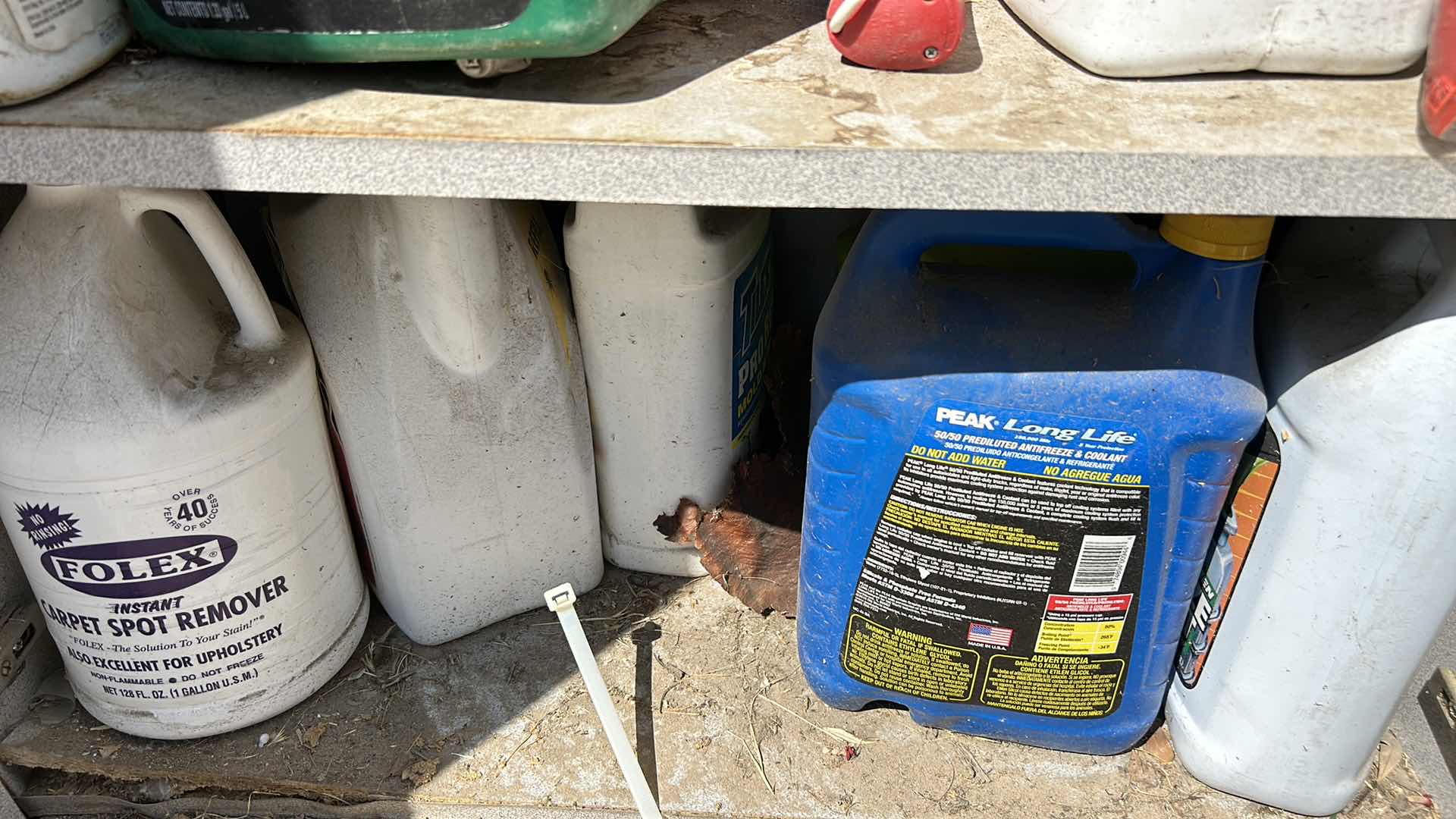 Photo 1 of CONTENTS OF CABINET- LANTERNS, OUTDOOR SUPPLIES , CLEANING SUPPLIES AND MORE